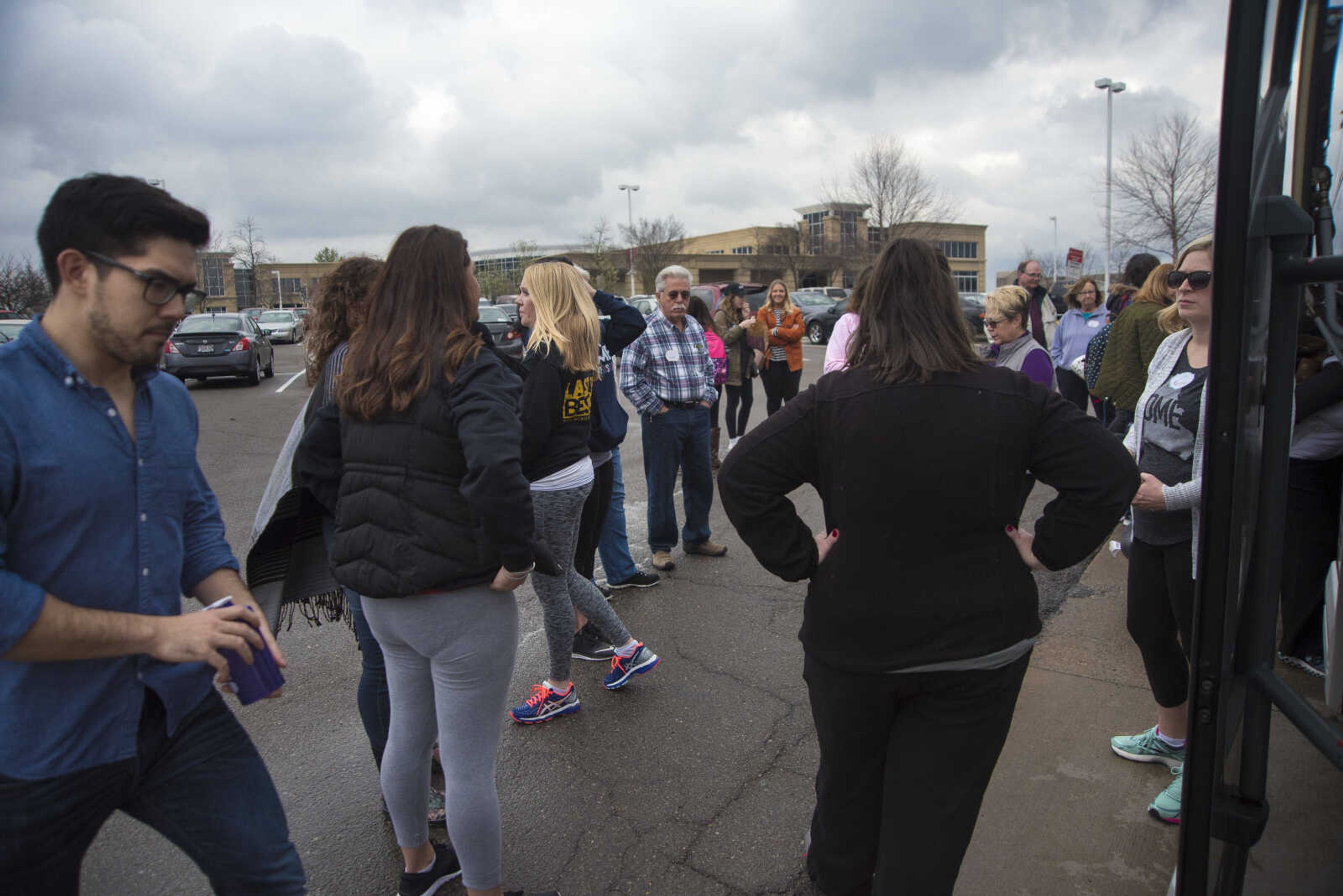 Protestors get ready to travel to Washington D.C. to participate in the Women's March on Saturday as they get ready to leave Friday, Jan. 20, 2017 in the Scully Building parking lot at Southeast Missouri State University in Cape Girardeau.