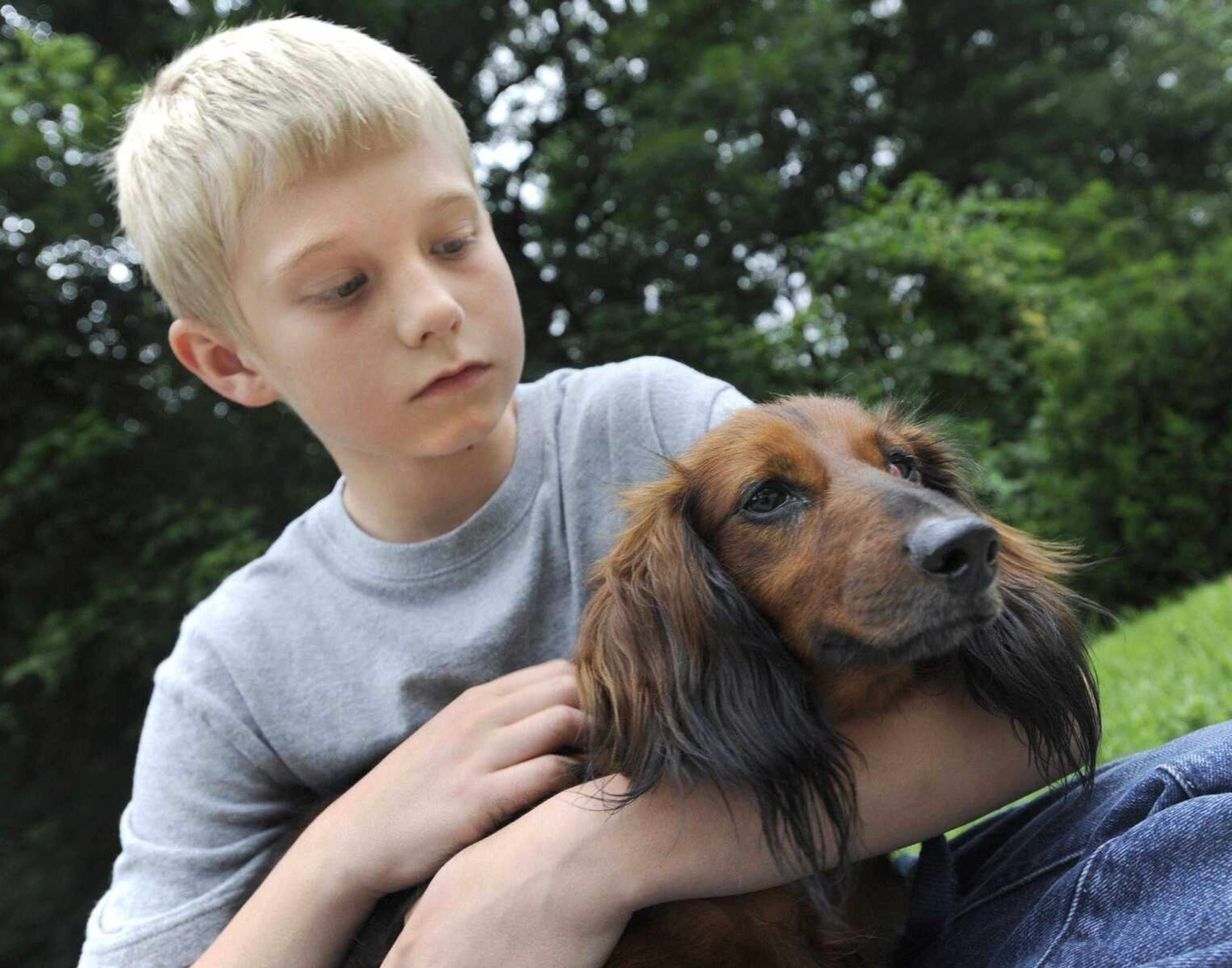 Hunter Miller, sitting with his dachshund, Rex, will have his birthday party Saturday at the Humane Society of Southeast Missouri.<br>FRED LYNCH <br>flynch@semissourian.com