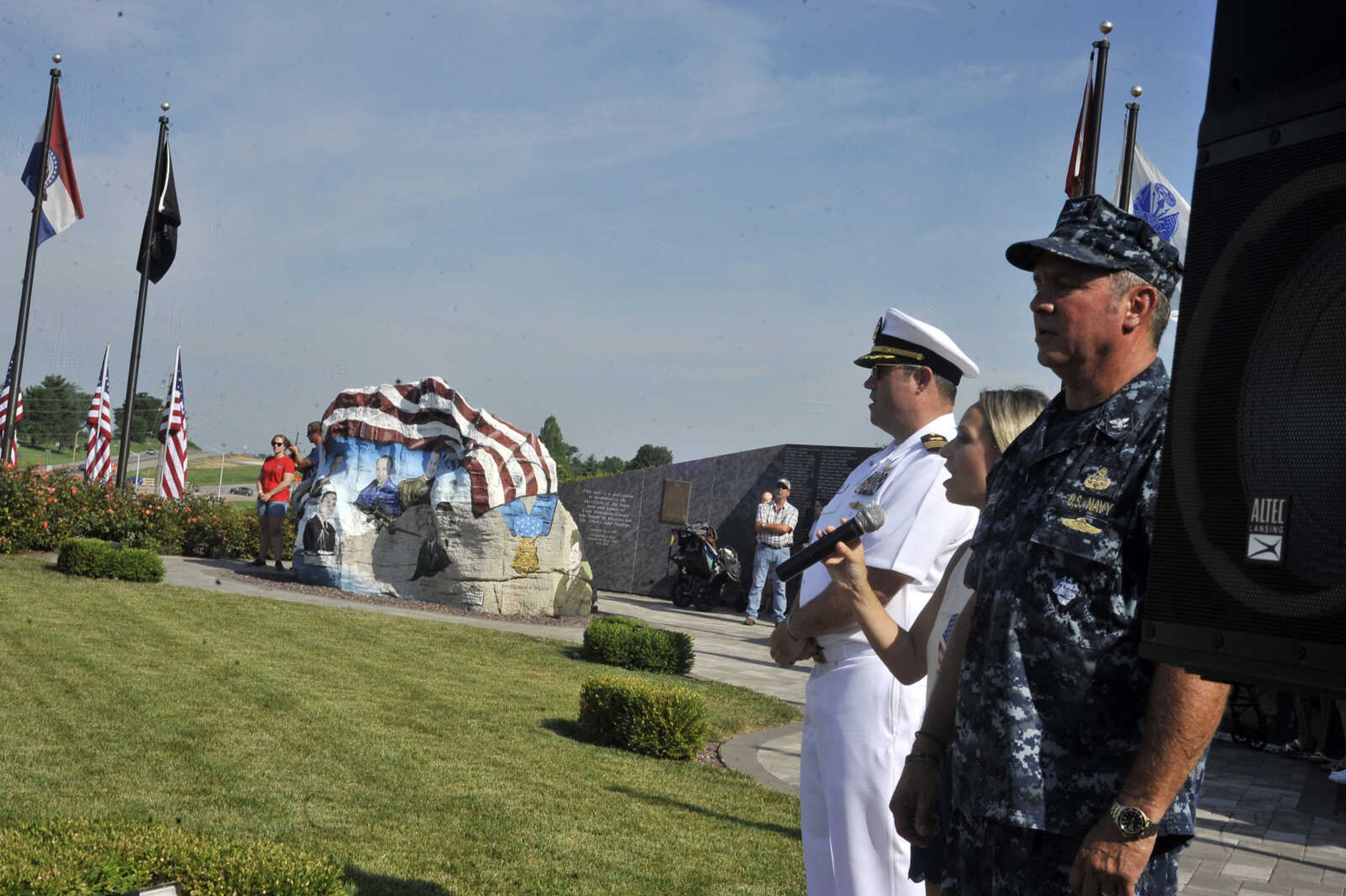 Casie Mills sings "God Bless America" at the conclusion of the Avenue of the Flags ceremony.