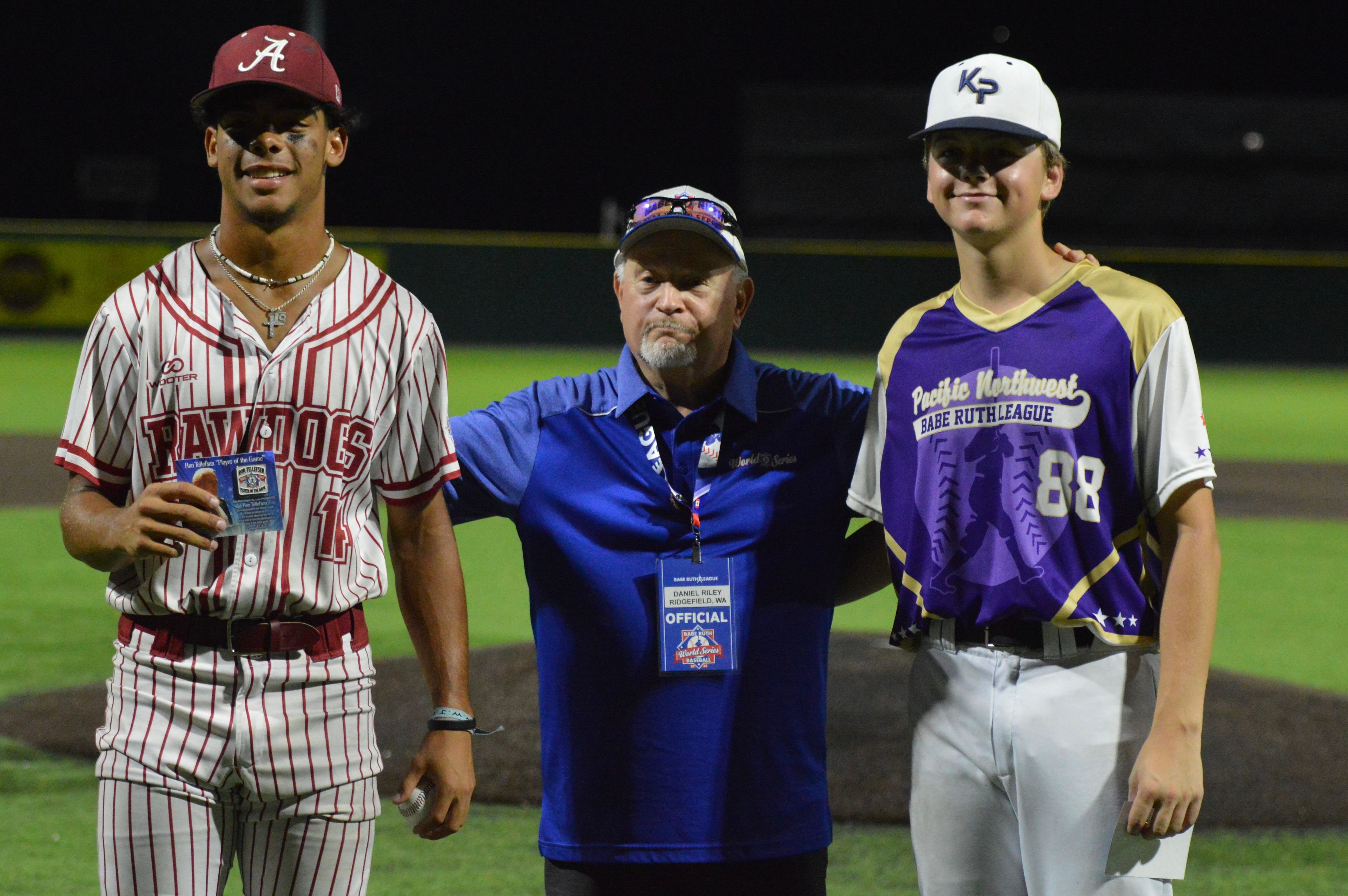 Alabama Rawdogs pitcher Will Thomas, left, and Kelso pitcher Noah Newton are awarded Players of the Game in the championship game of the Babe Ruth World Series on Thursday, Aug. 15, at Capaha Field in Cape Girardeau, Mo. 