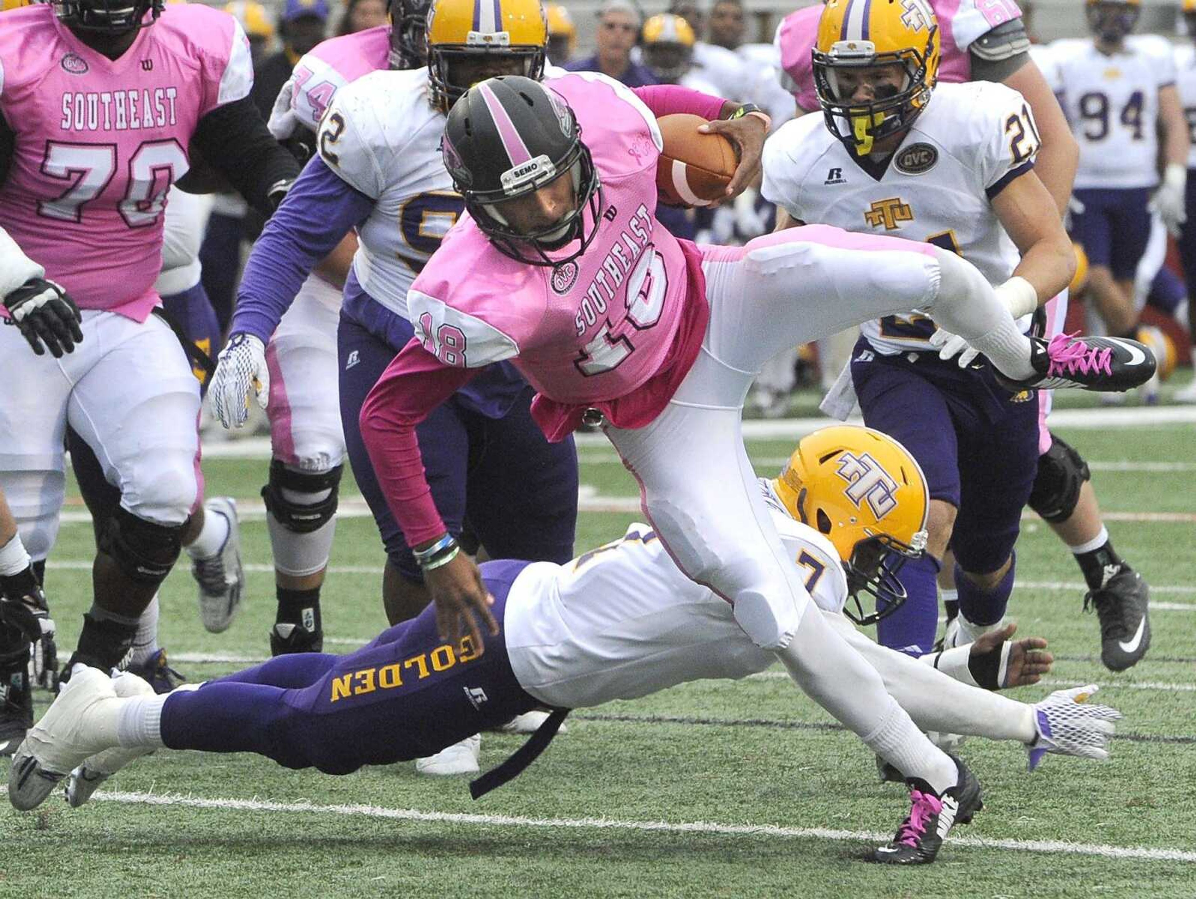 Southeast Missouri State quarterback Dante Vandeven eludes Tennessee Tech's Bill Dillard on an 8-yard touchdown run during the fourth quarter Saturday, Oct. 31, 2015 at Houck Stadium. (Fred Lynch)