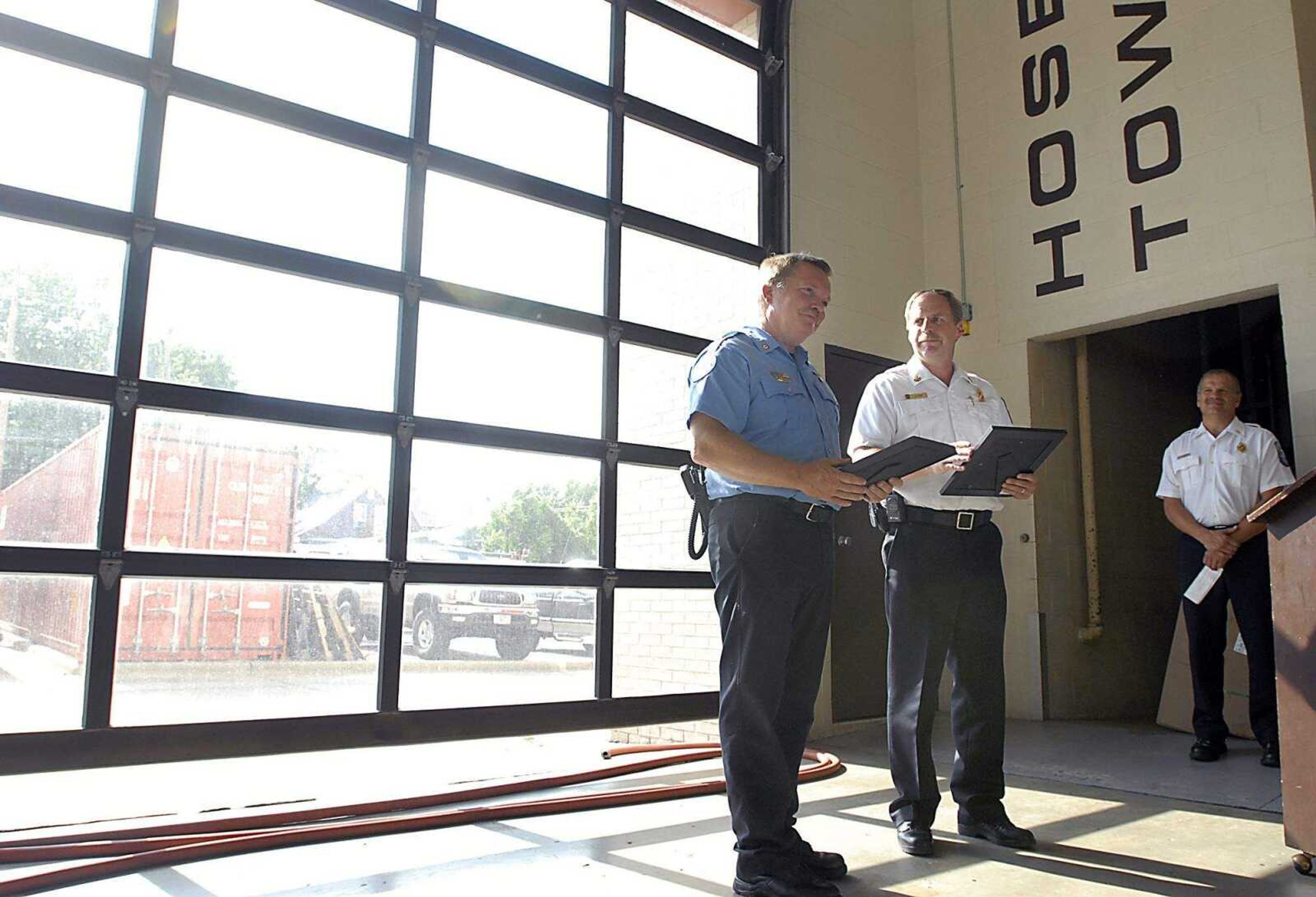 KIT DOYLE ~ kdoyle@semissourian.com
Cape Girardeau Fire Chief Rick Ennis, right, presented Harry Schumer with the Medal of Valor Friday afternoon, June 6, 2008, at Cape Girardeau Fire Station No. 1. While off duty, Schumer broke out a windshield with his bare hands to save a man from his flaming vehicle.