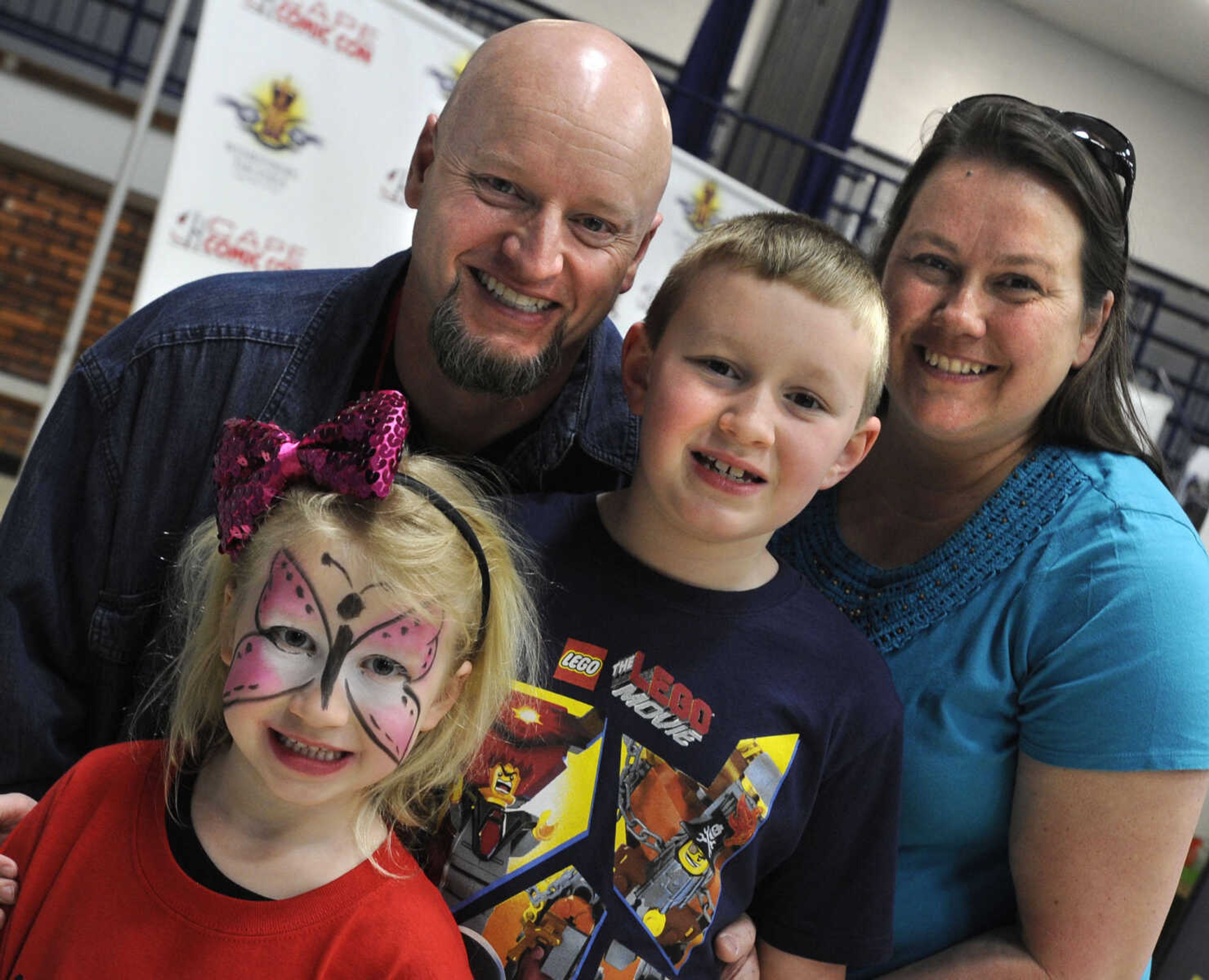 Emma and Jacob Chronister pose with their parents, John and Jan Chronister of Wappapello, Mo. at Cape Comic Con on Saturday, March 22, 2014 at the Arena Building.