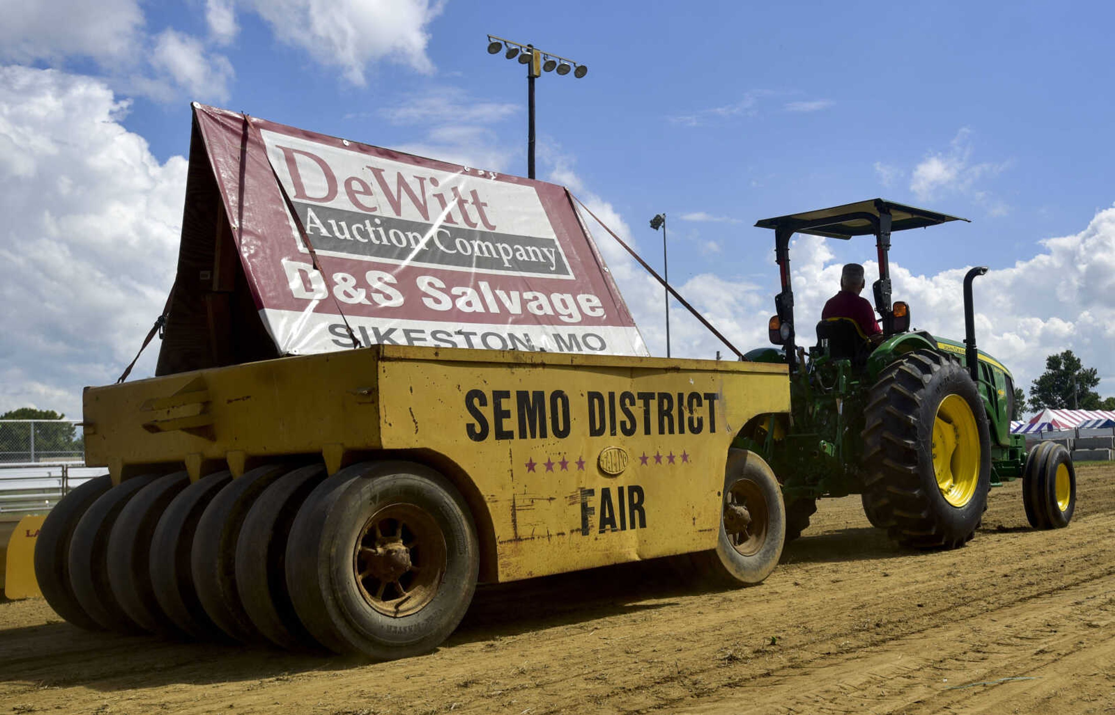 Tractors smooth dirt in the grandstands at the SEMO District Fairgrounds on Thursday, Sept. 6, 2018, in Cape Girardeau.