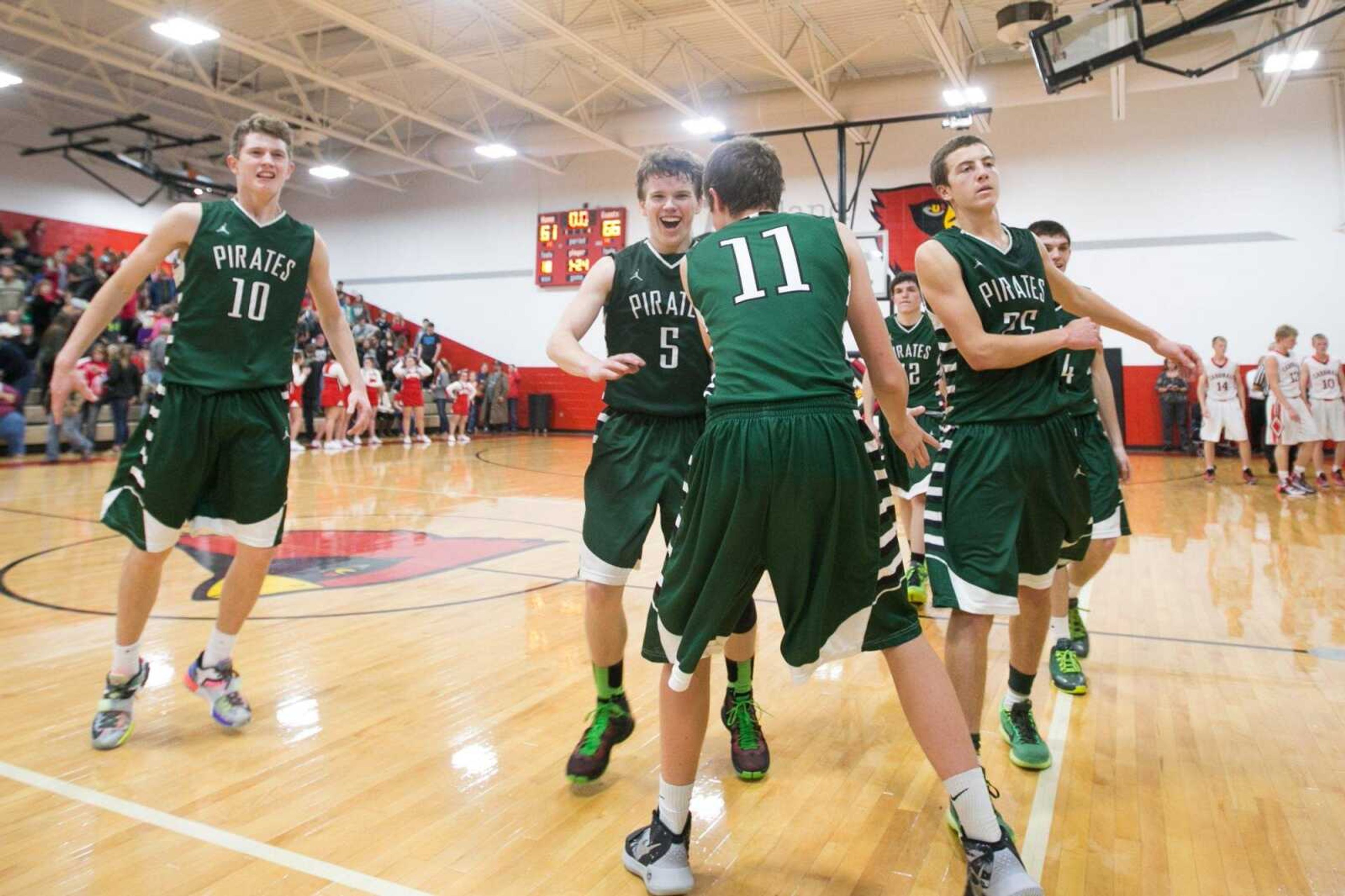 Perryville players celebrate after their win over Woodland in a semifinal game during the Woodland Invitational Tournament Thursday, Dec. 3, 2015. (Glenn Landberg)