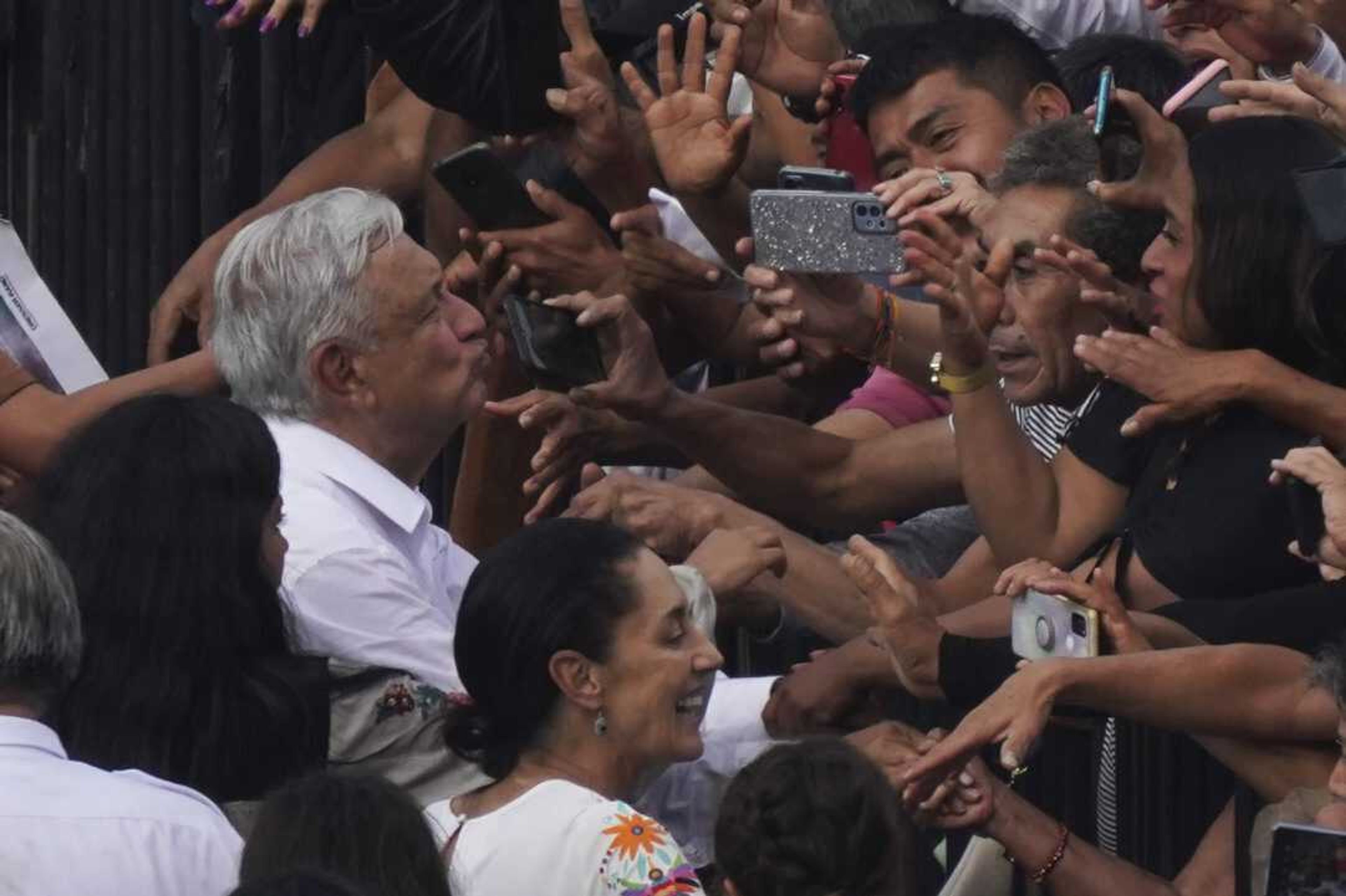 Mexican President Andres Manuel Lopez Obrador greets supporters as he arrives at the capital's main square, the Zocalo, Sunday, Nov. 27, in Mexico City.