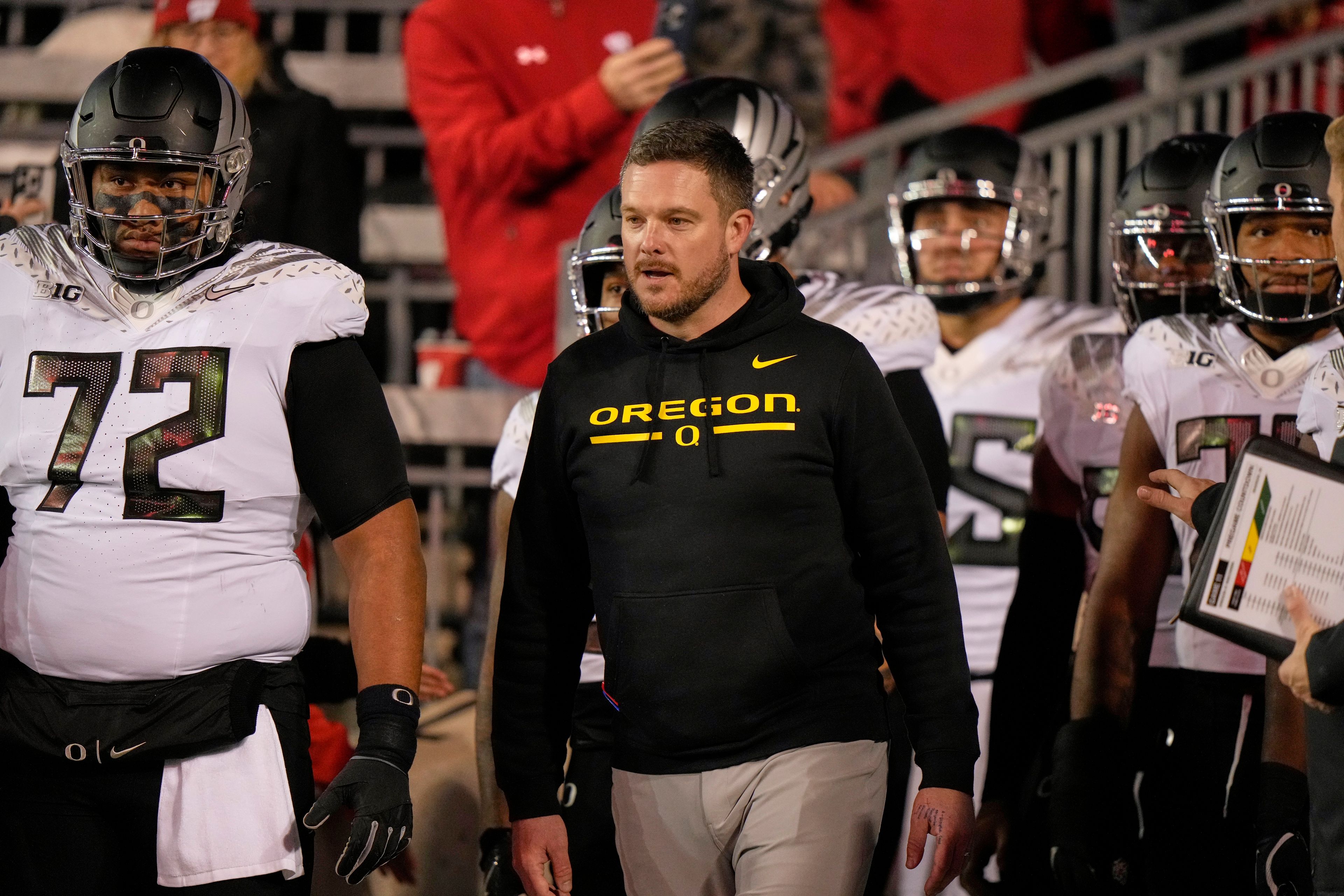 Oregon head coach Dan Lanning leads his team to the field before an NCAA college football game against Wisconsin Saturday, Nov. 16, 2024, in Madison, Wis. (AP Photo/Morry Gash)