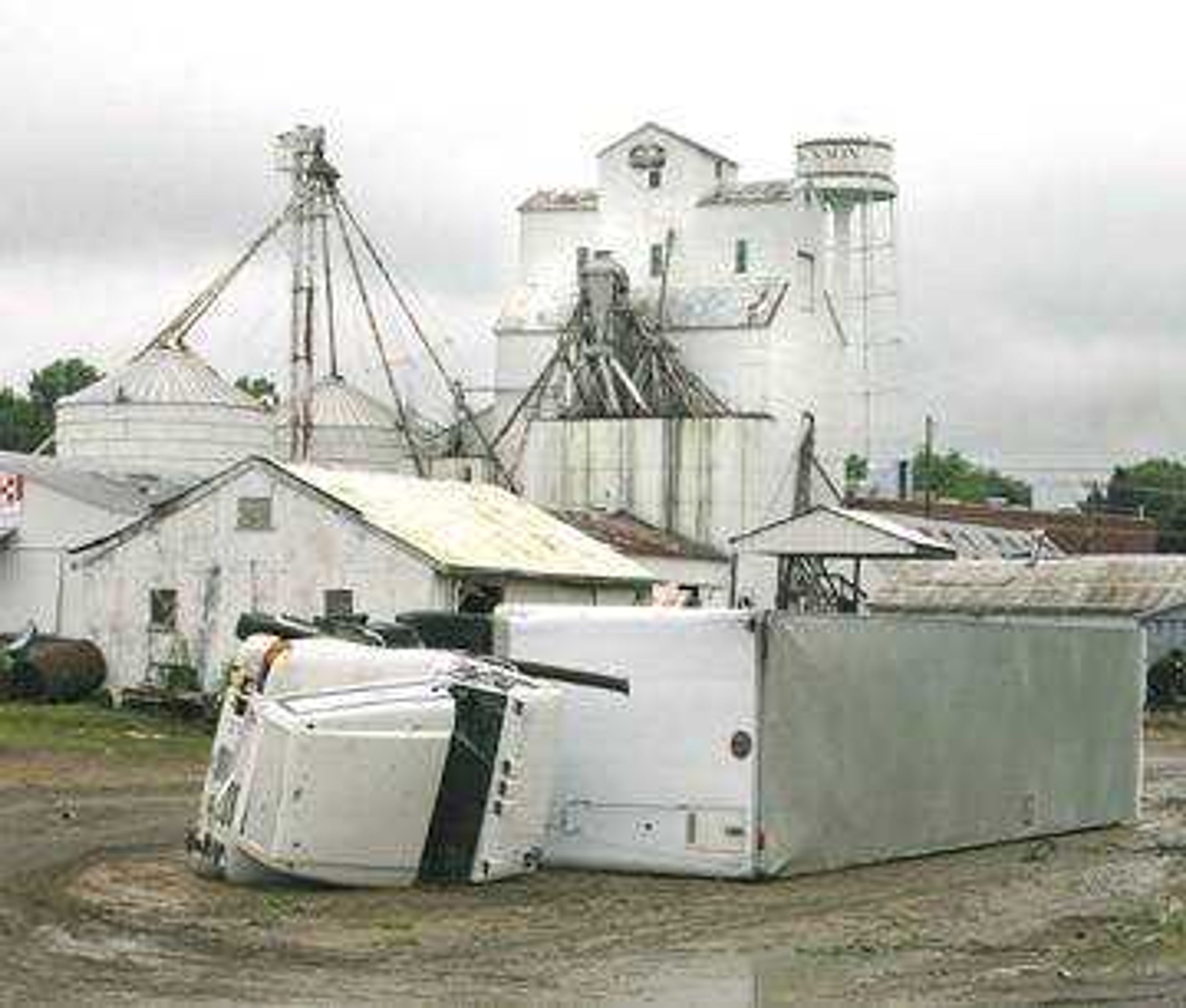 A semi tractor-trailer rests on its side after being blown over during Tuesday's tornado in Jackson.