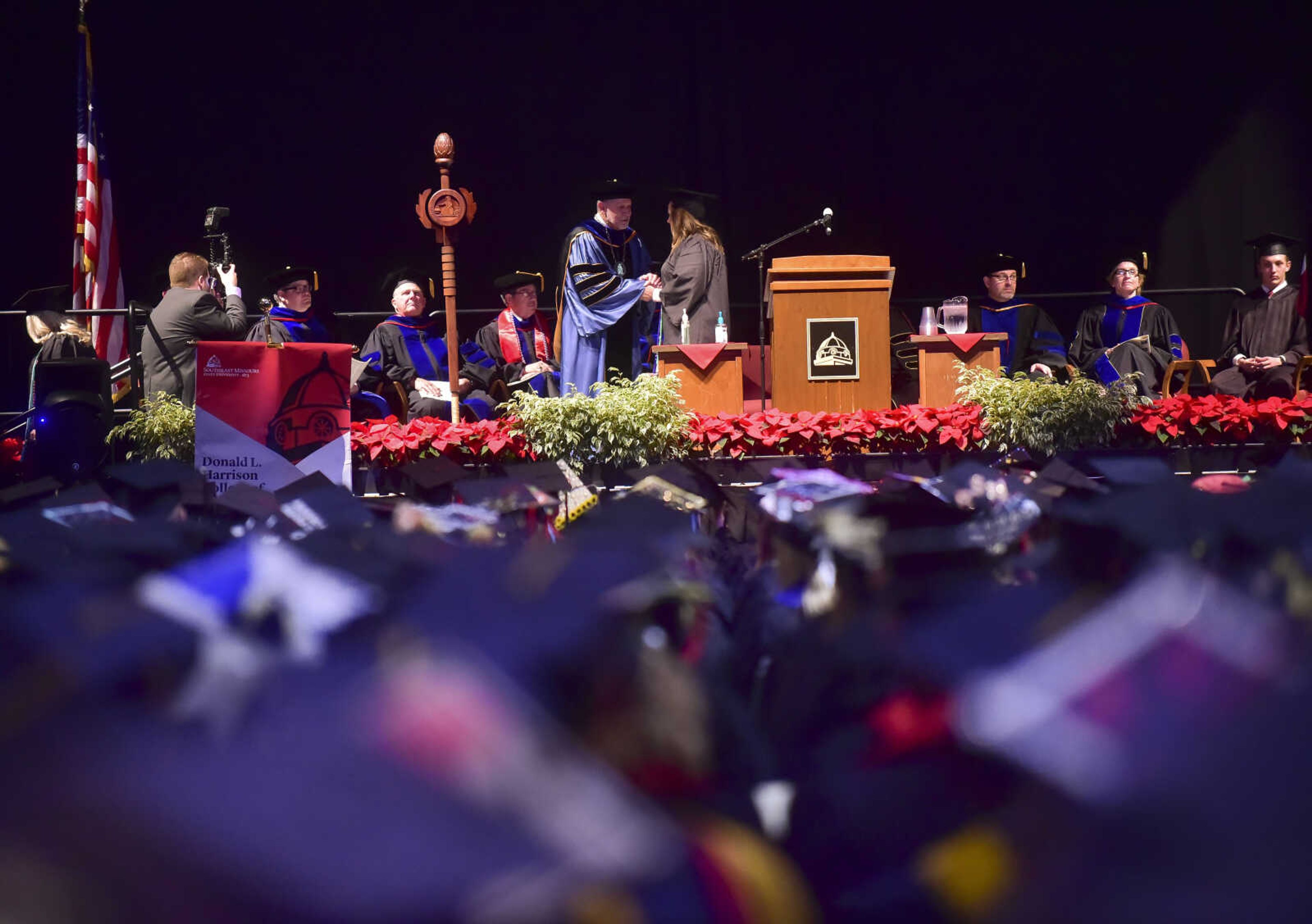 ANDREW J. WHITAKER ~ awhitaker@semissourian.com
Students walk on stage during Southeast Missouri State University graduation Saturday, Dec. 17, 2016 at the Show Me Center in Cape Girardeau.