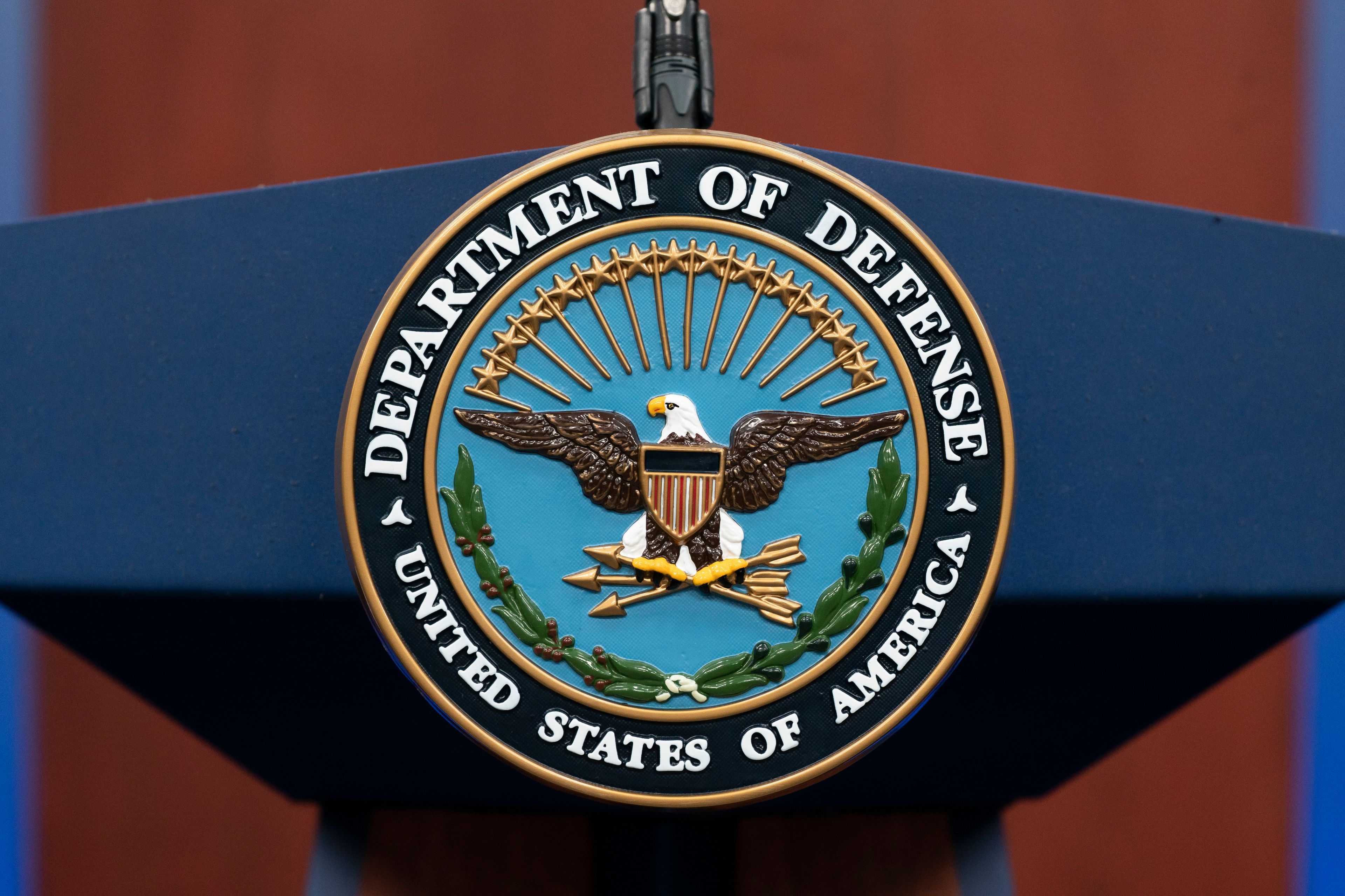 FILE - The seal of the Department of Defense is seen on the podium at the Pentagon, Sept. 27, 2022, in Washington. The Pentagon says the U.S. is sending an additional “few thousand” troops to the Middle East to bolster security and to be prepared to defend Israel if necessary. (AP Photo/Alex Brandon, File)