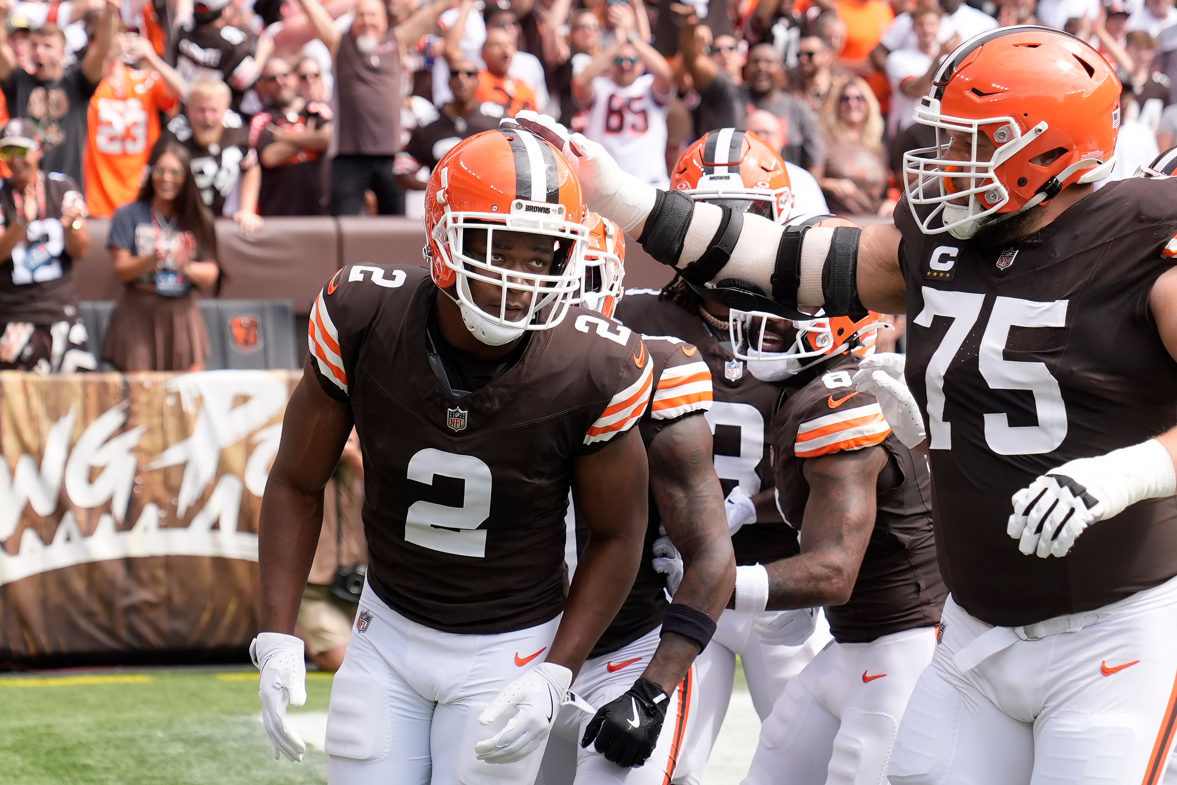 Cleveland Browns wide receiver Amari Cooper (2) is congratulated by guard Joel Bitonio (75) after scoring against the New York Giants during the first half of an NFL football game, Sunday, Sept. 22, 2024 in Cleveland. (AP Photo/Sue Ogrocki)