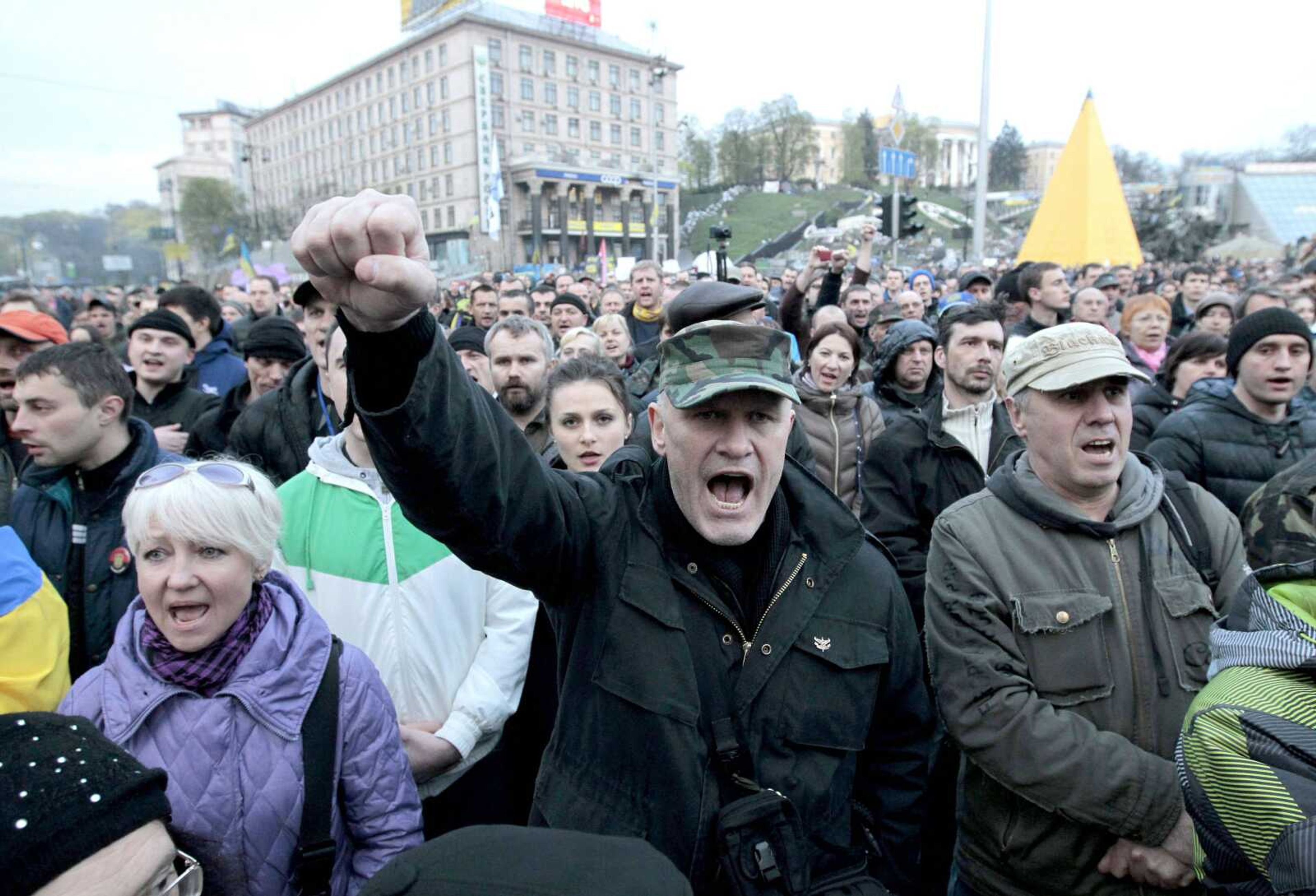 People shout slogans during a rally Monday in Independence Square in Kiev. Ukraine&#8217;s acting president urged the United Nations on Monday to send peacekeeping troops to eastern Ukraine, where pro-Russian gunmen kept up their rampage of storming and occupying local government offices, police stations and a small airport. (Sergei Chuzavkov ~ Associated Press)