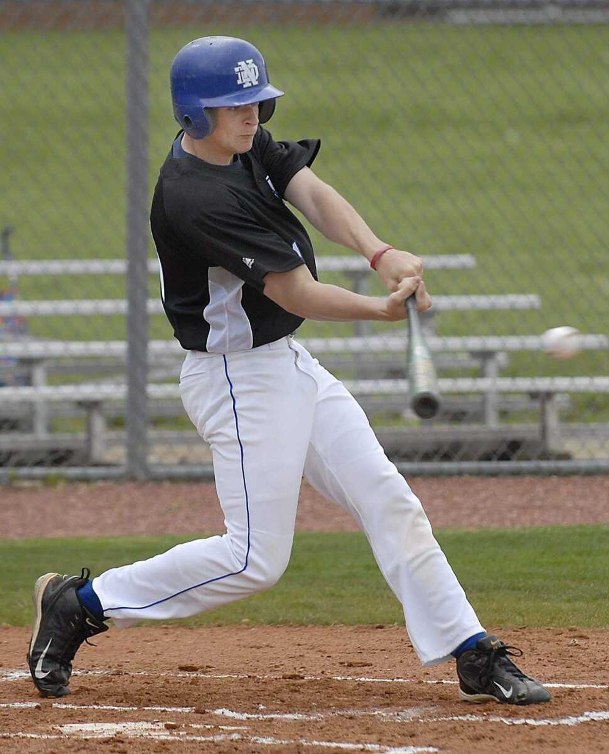 KIT DOYLE ~ kdoyle@semissourian.comAustin Greer drives in a run during a Notre Dame district playoff game last season.