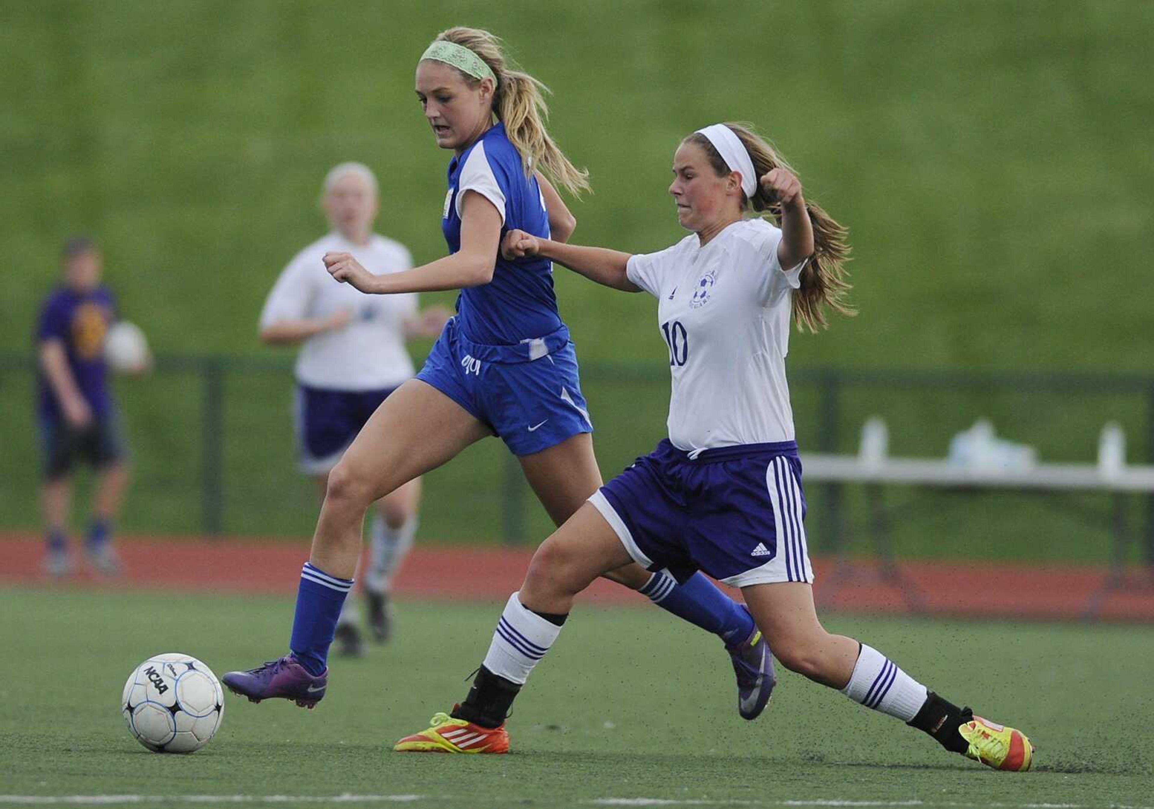 Notre Dame&#8217;s Taylor Rinda tries to get past Rosati-Kain&#8217;s Brooke Greiner during their Class 2 quarterfinal game. Additional photos can be viewed at semoball.com.