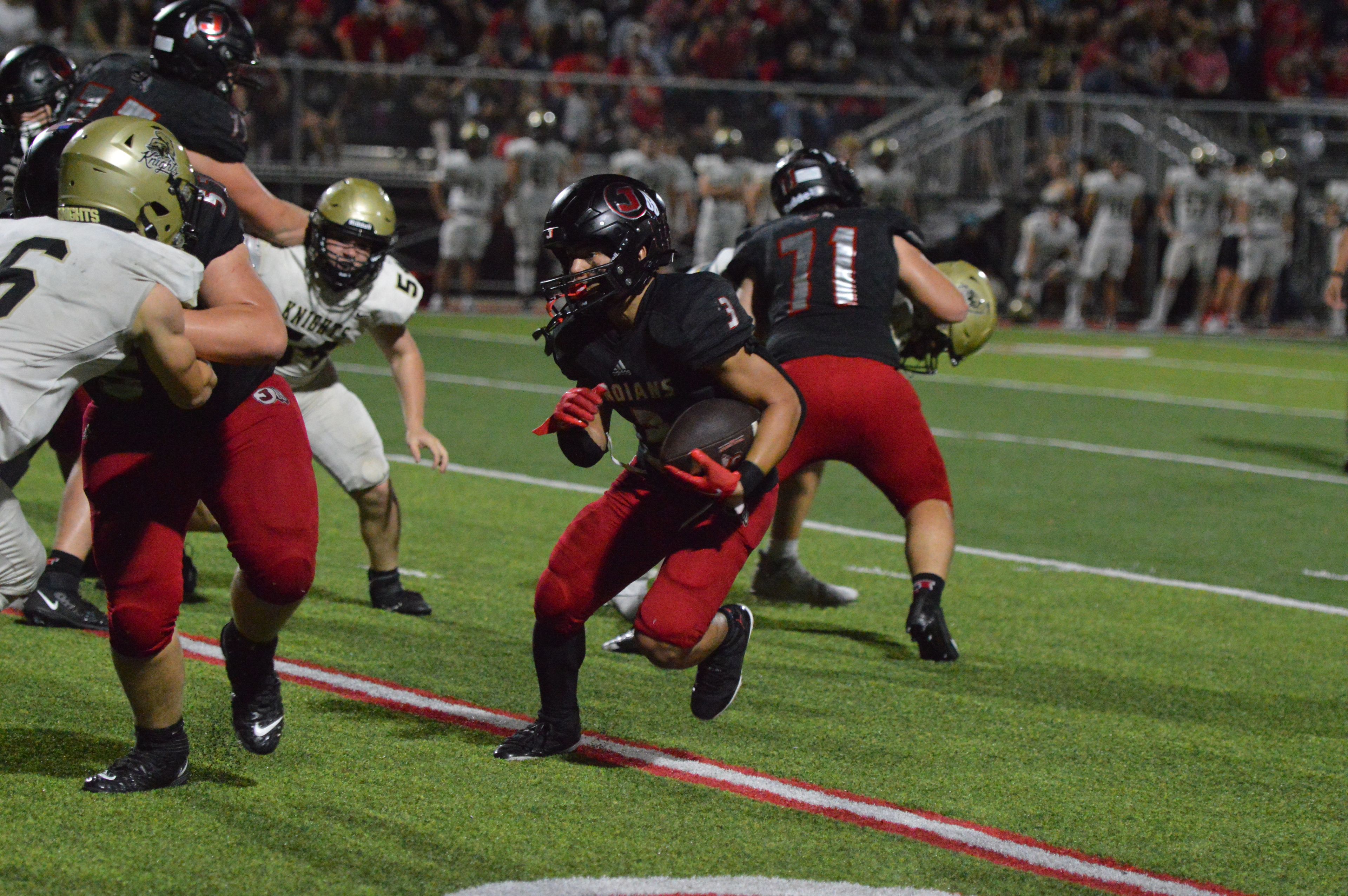 Jackson sophomore running back Jaylon Hampton bounces an outside run against Farmington on Friday, Sept. 20.