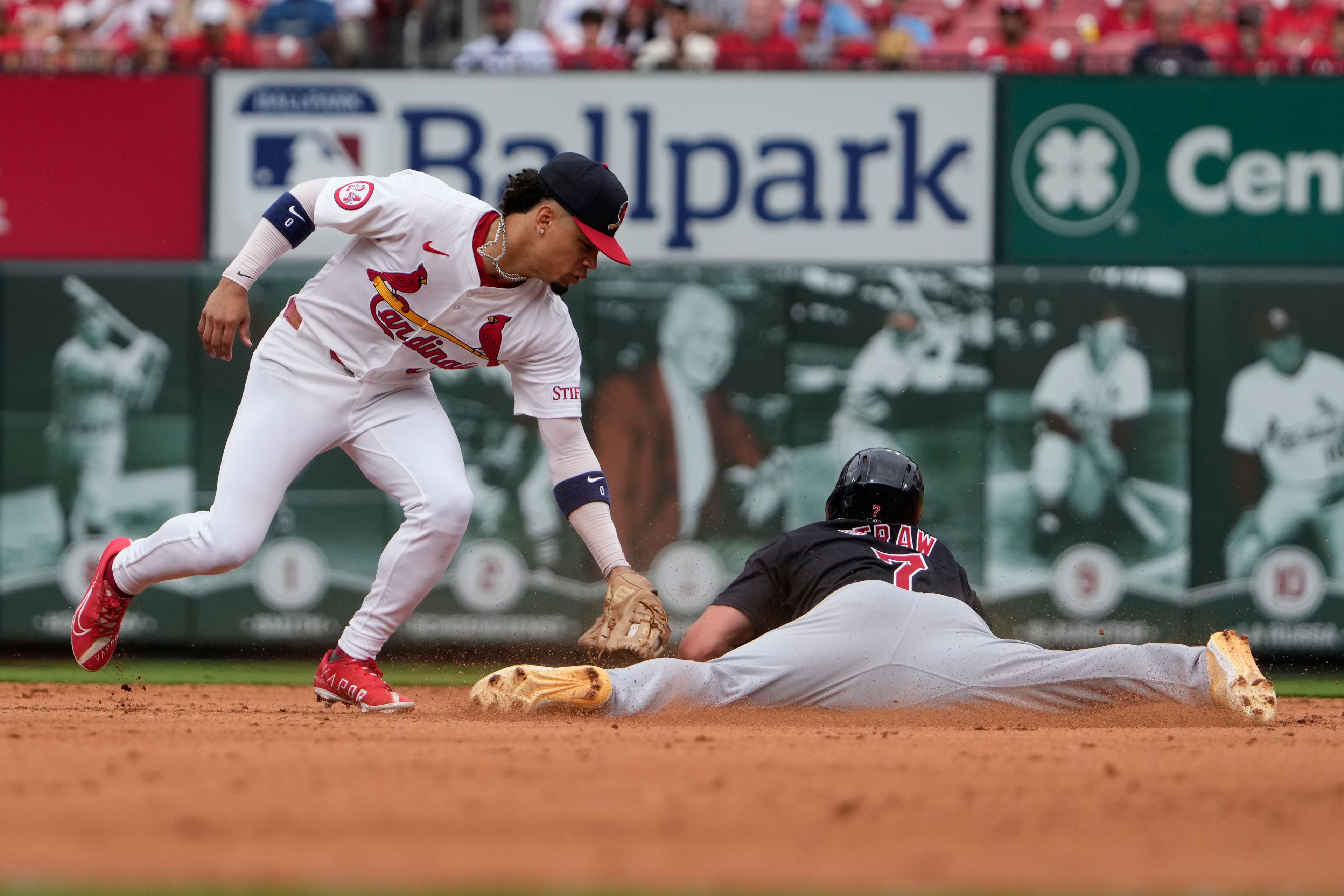 Cleveland Guardians' Myles Straw (7) steals second ahead of the tag from St. Louis Cardinals shortstop Masyn Winn during the sixth inning of a baseball game Sunday, Sept. 22, 2024, in St. Louis. (AP Photo/Jeff Roberson)