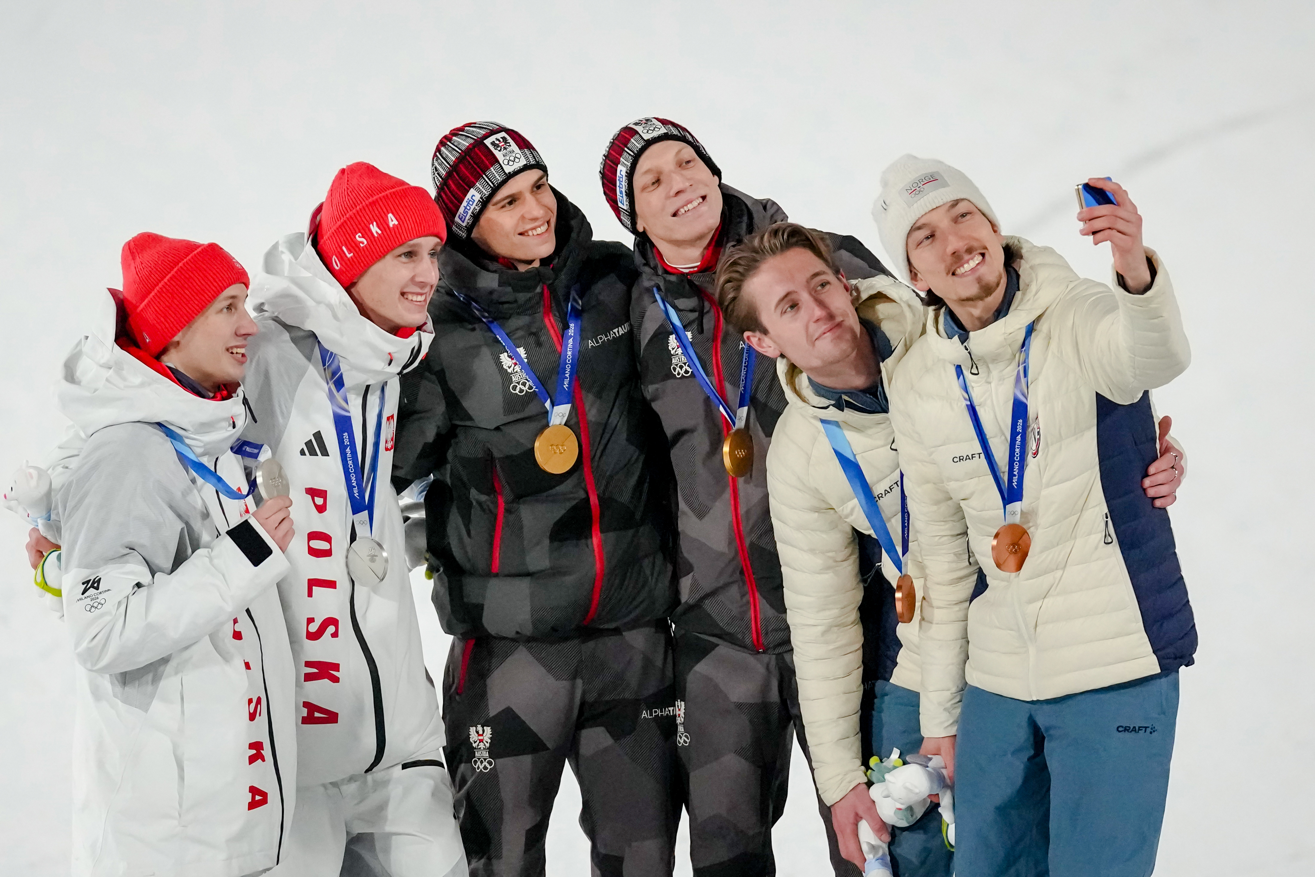 Austria wins gold in 1st Olympic men's super team ski jump a