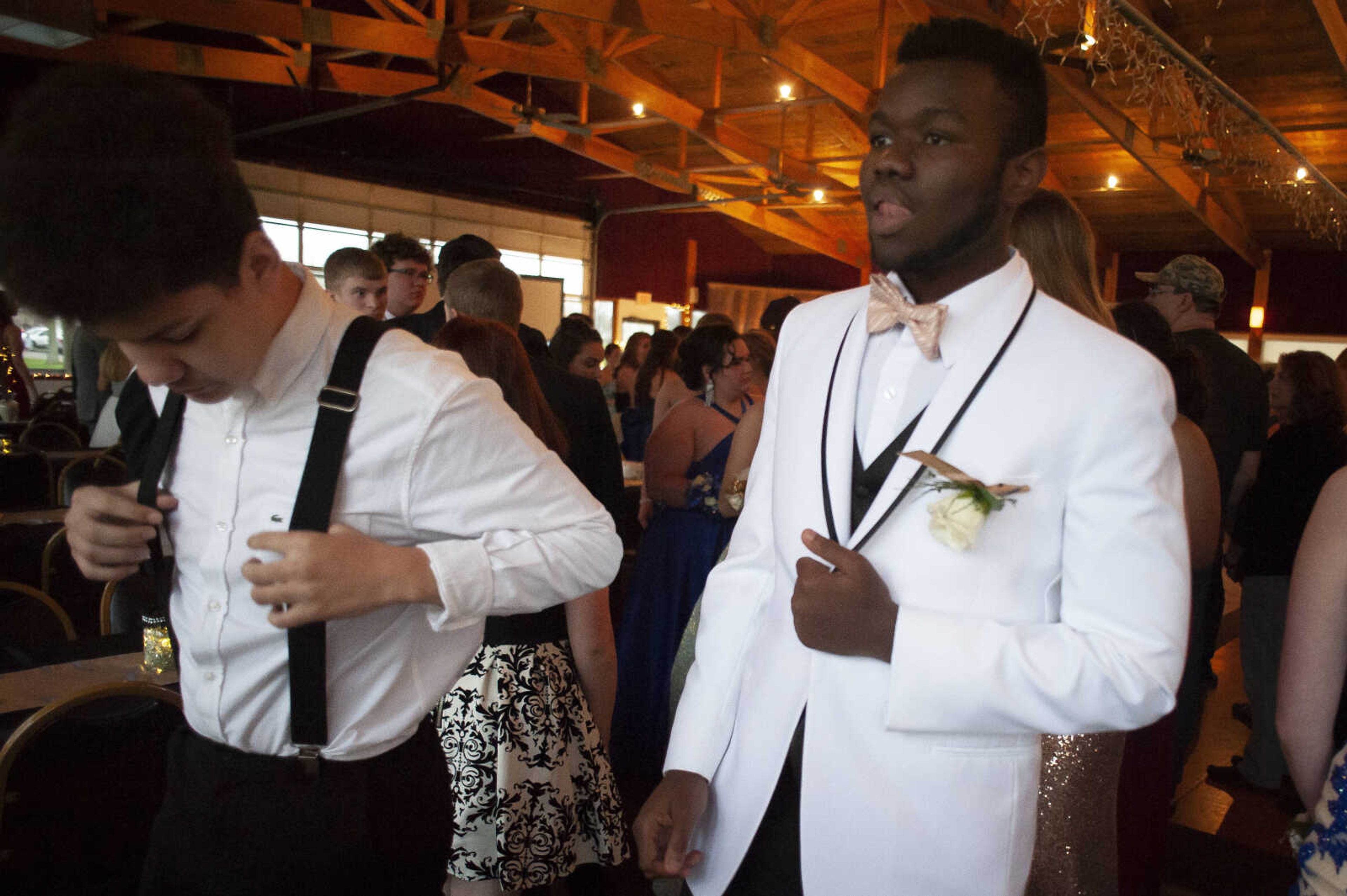 Scott City sophomores Noah Rushing, left, and Neavon Brown get into line before students are announced during Scott City's prom Saturday, April 6, 2019, at Deerfield Lodge in Cape Girardeau.