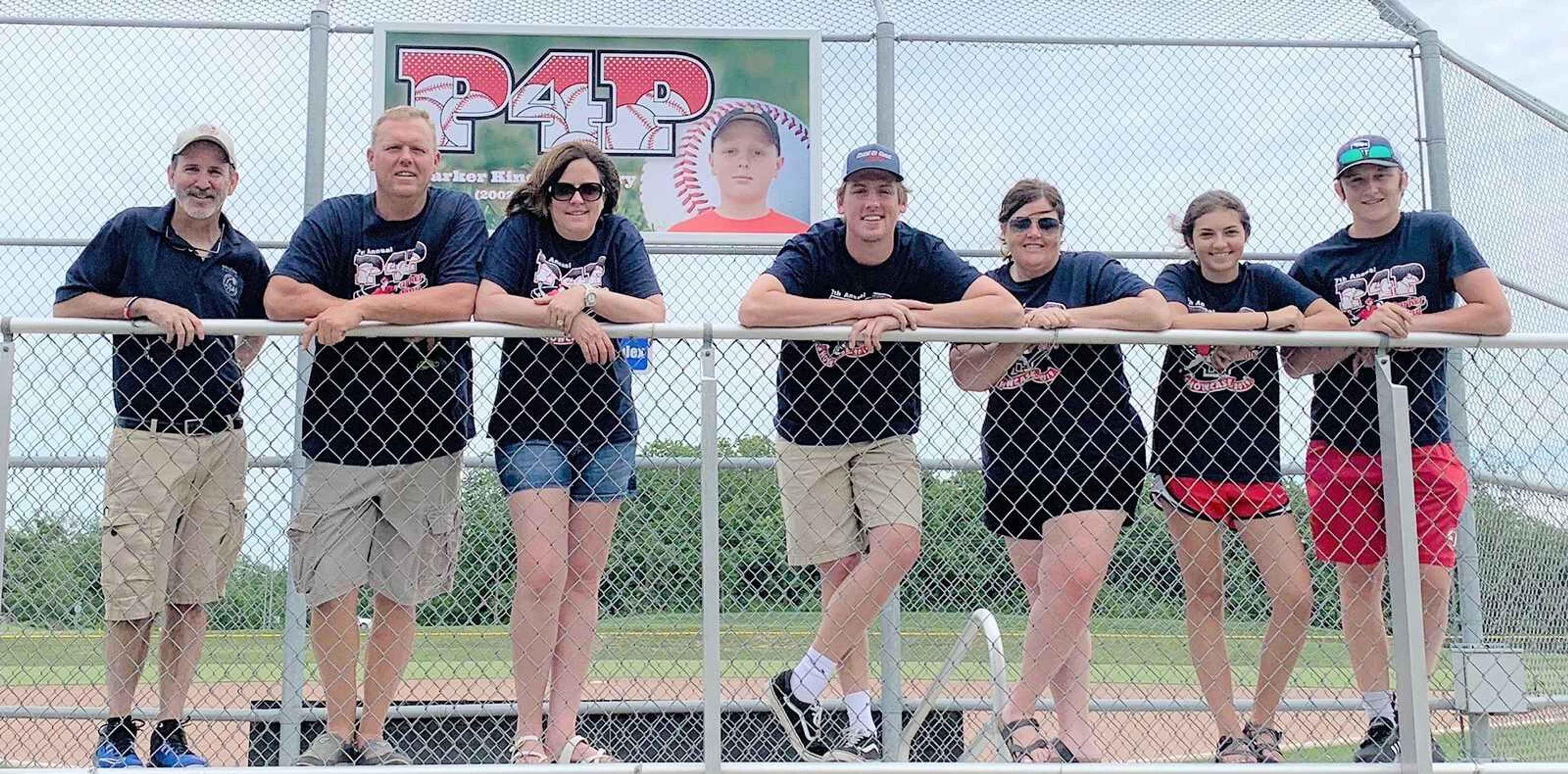 Scott Williams recreation division manager, represented the Parks and Recreation Foundation at the dedication ceremony, Picture from left on the bleachers, Scott Williams with family members of the late Parker King, parents, Jamie King and Robin King, Drew King, Cheryl Farrow, Alexa Deluca and Jacob Farrow.