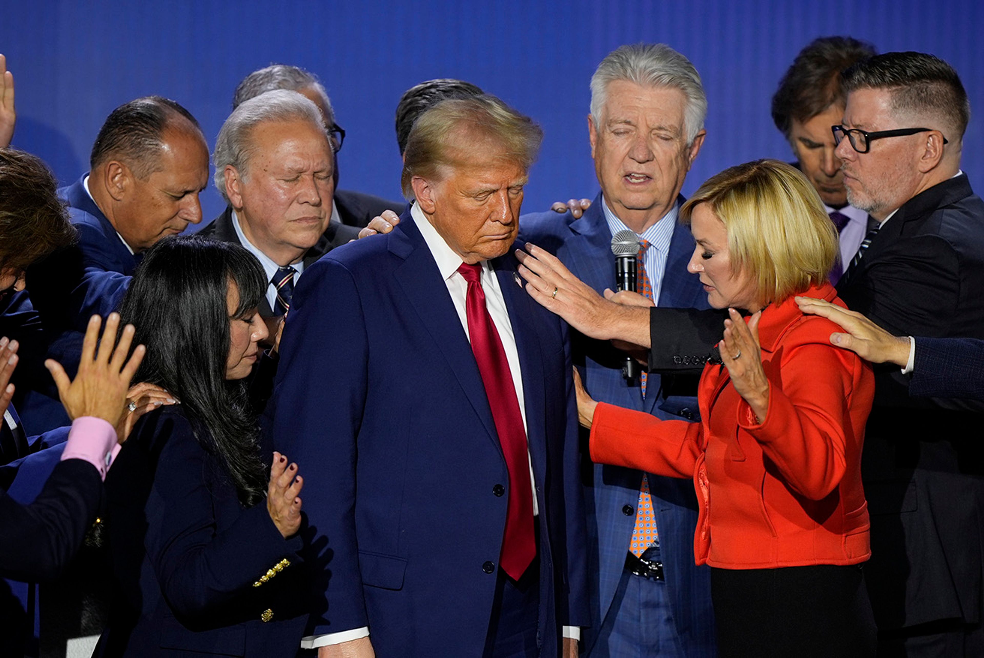 Republican presidential nominee former President Donald Trump is prayed over with Pastor Paula White during the National Faith Summit at Worship With Wonders Church, Monday, Oct. 28, 2024, in Powder Springs, Ga.