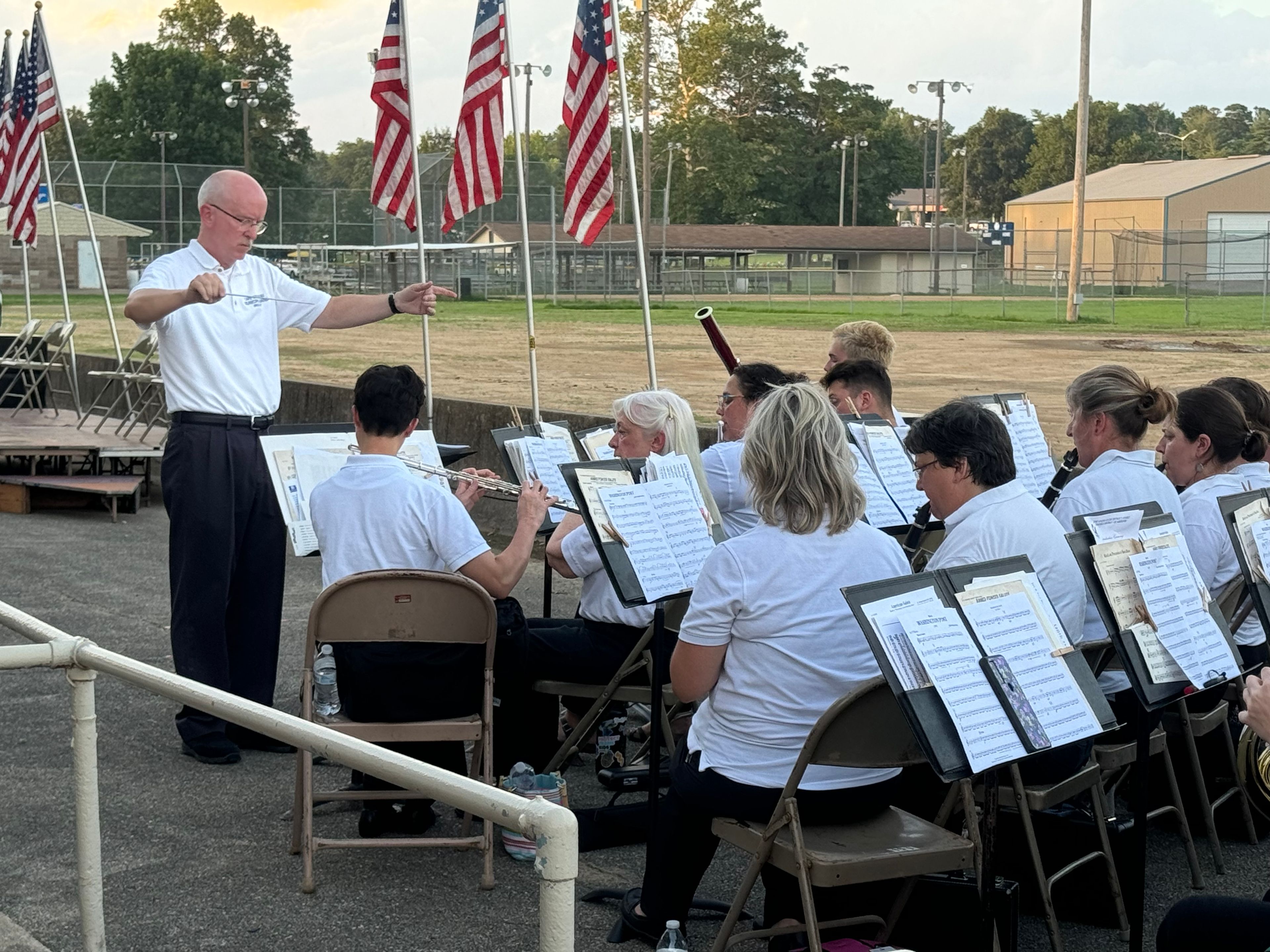 Neil Casey, left, directs Cape Municipal Band as they play patriotic songs at Cape Girardeau's Great American Fourth of July Celebration on Thursday, July 4, at Arena Park.