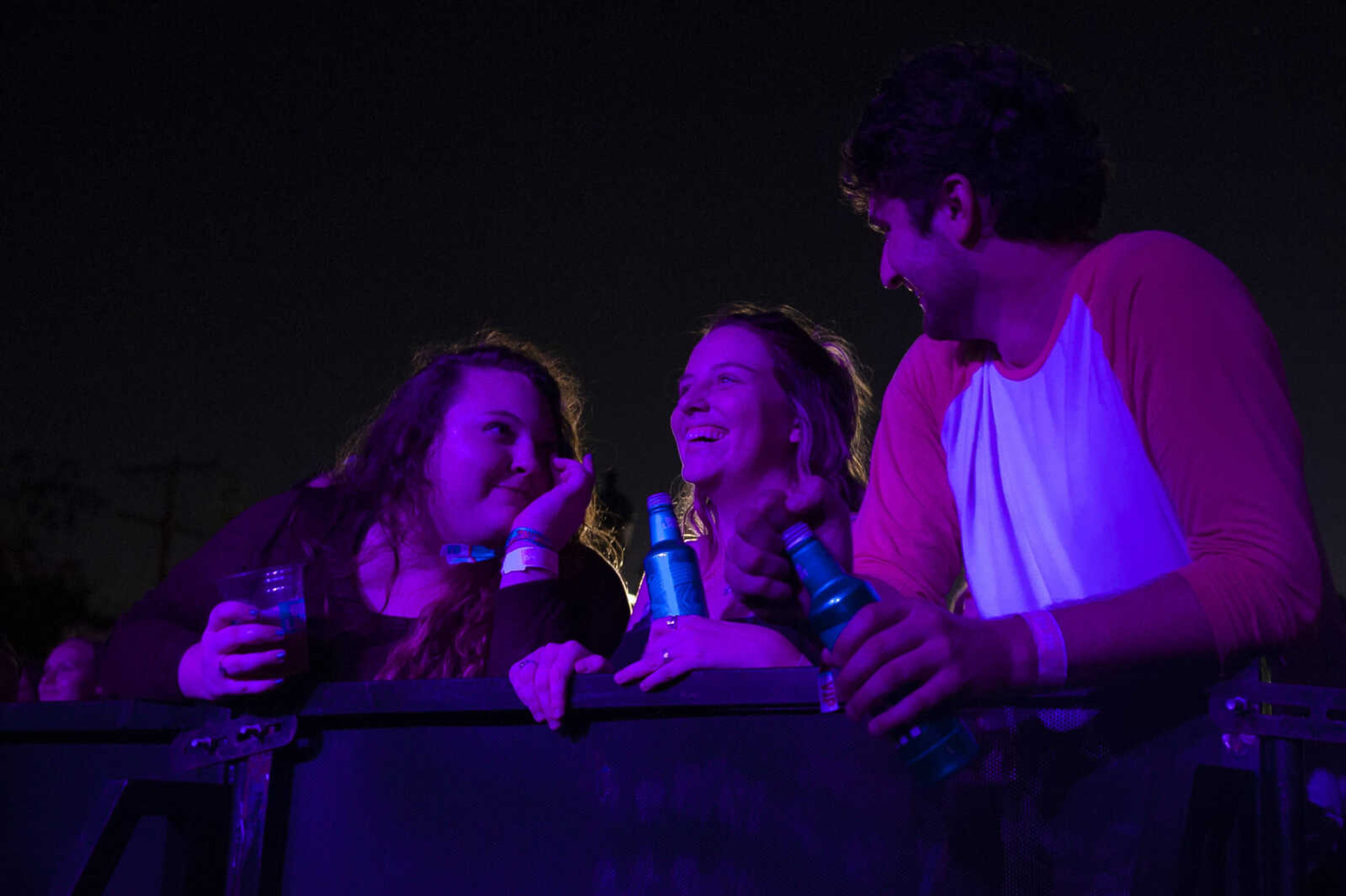 From left: Veronica Young, Maddie Noonan and Ben Wedemeier watch as Dawson Hollow performs during Shipyard Music and Culture Festival on Friday, Sept. 27, 2019, in Cape Girardeau.