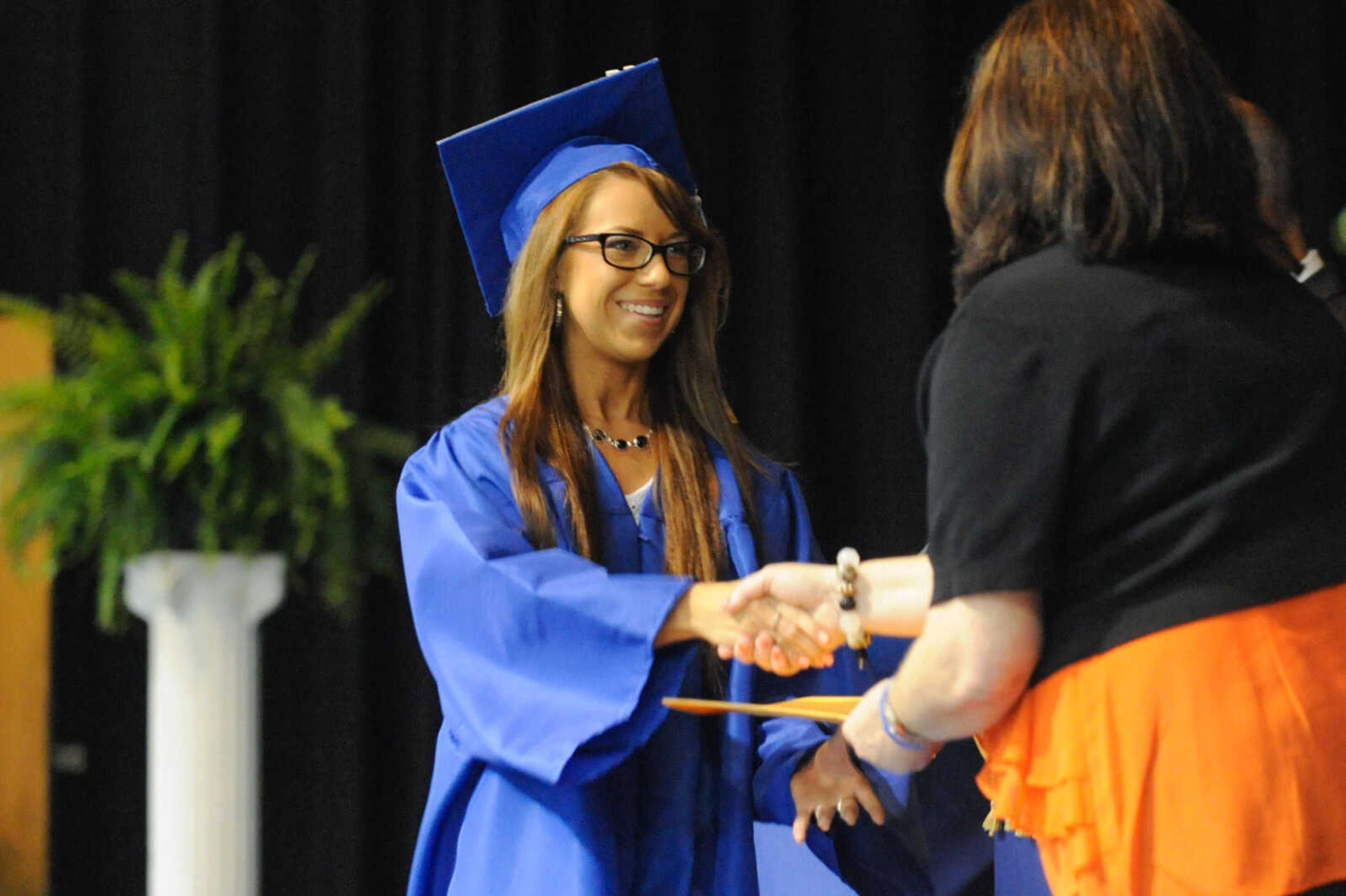 GLENN LANDBERG ~ glandberg@semissourian.com

Seniors receive their diplomas during the Scott City commencement Sunday, May 17, 2015 at Scott City High School.