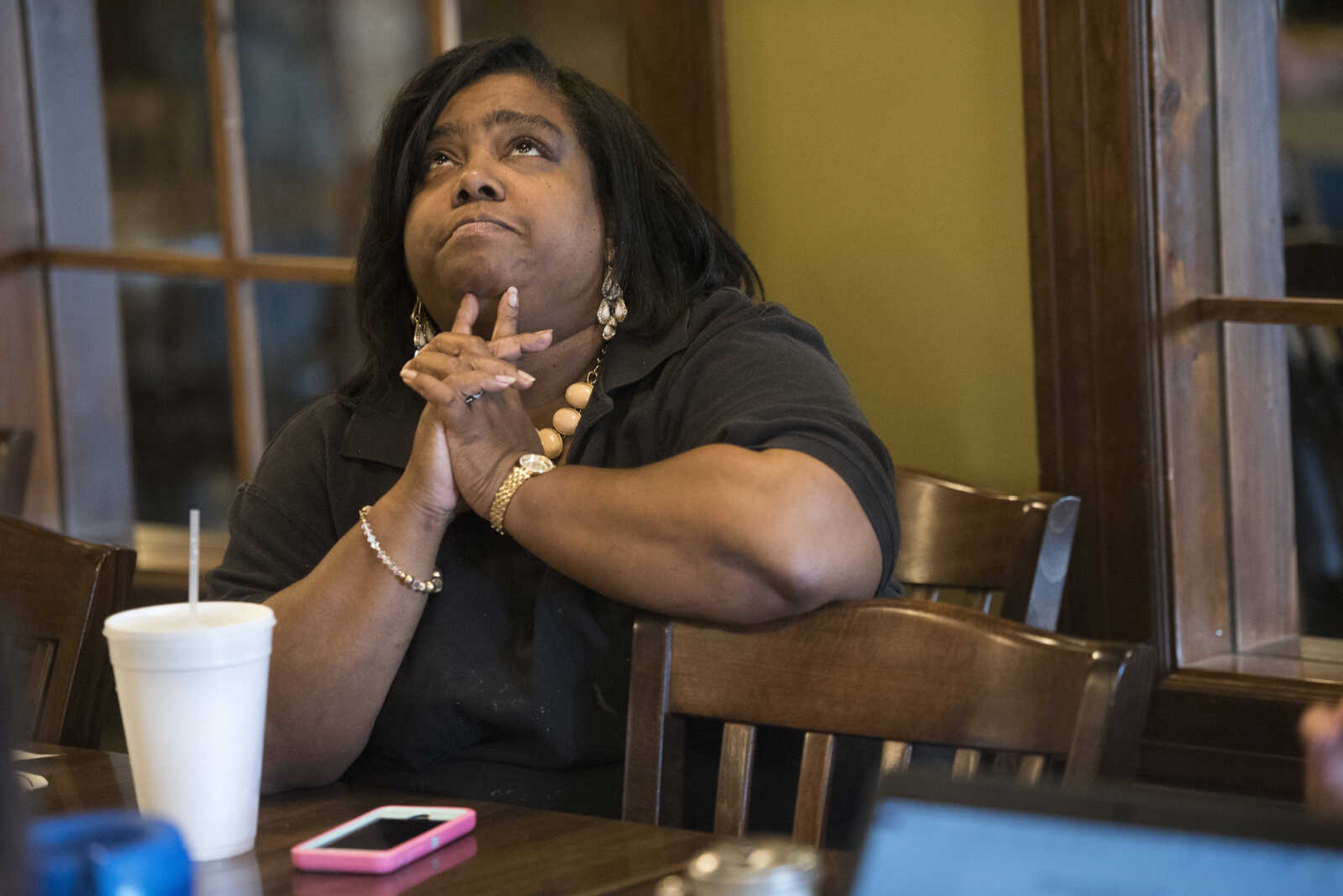 Latoya Robinson-Tate attends a community meeting on June 12, 2017 at Wally's in Charleston.