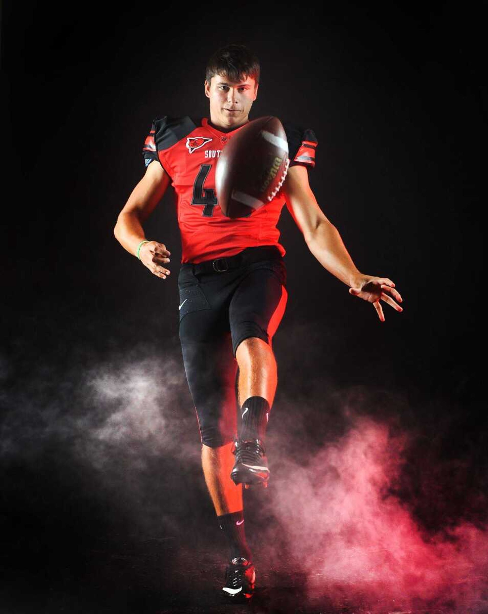 Once a place-kicker, Alex Knight is now a full-time punter for the Redhawks.