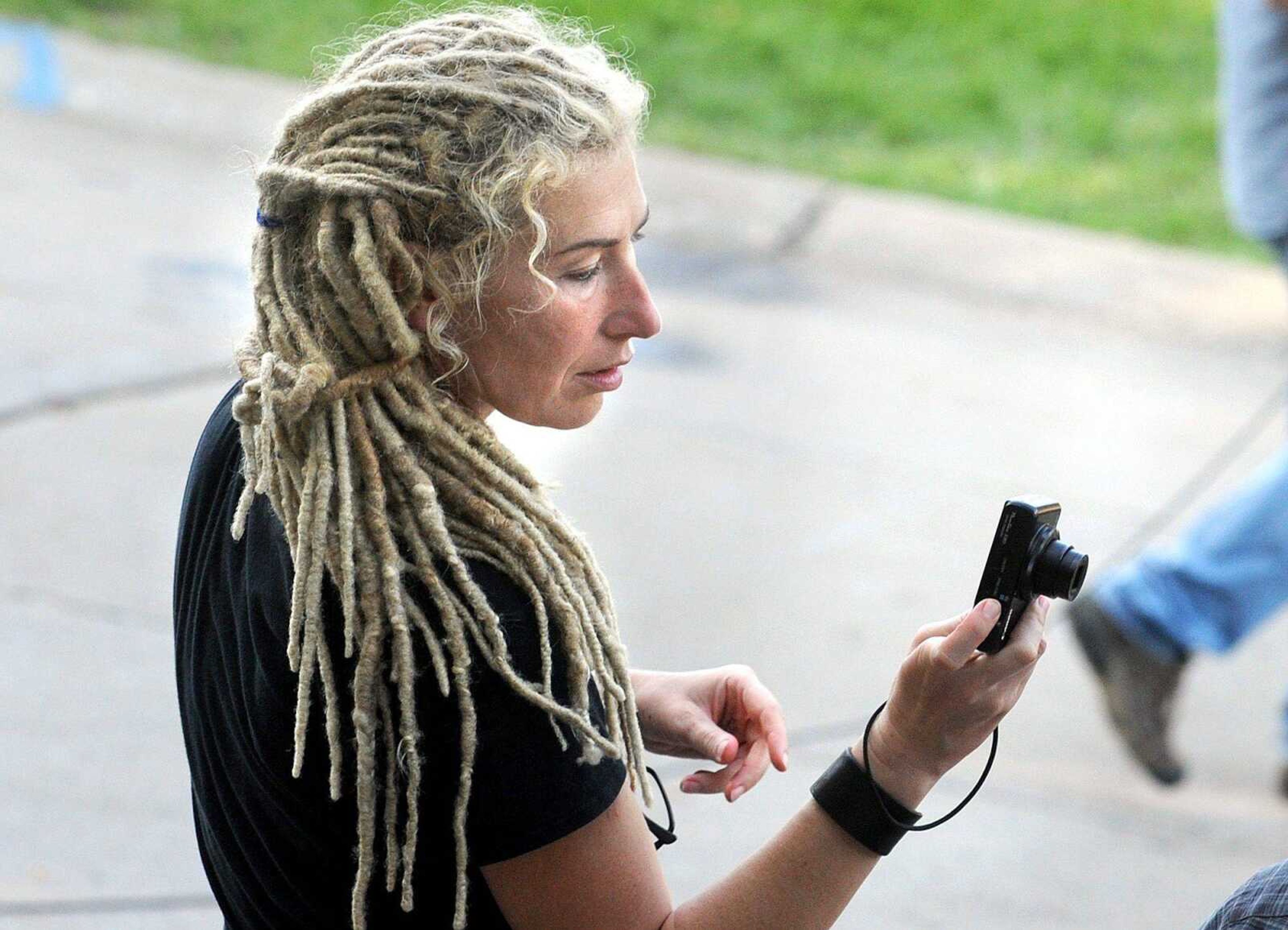 Kate Biscoe, key makeup artist for the film "Gone Girl", takes a photo of an actor between takes to record the continuity of his makeup. (Laura Simon)