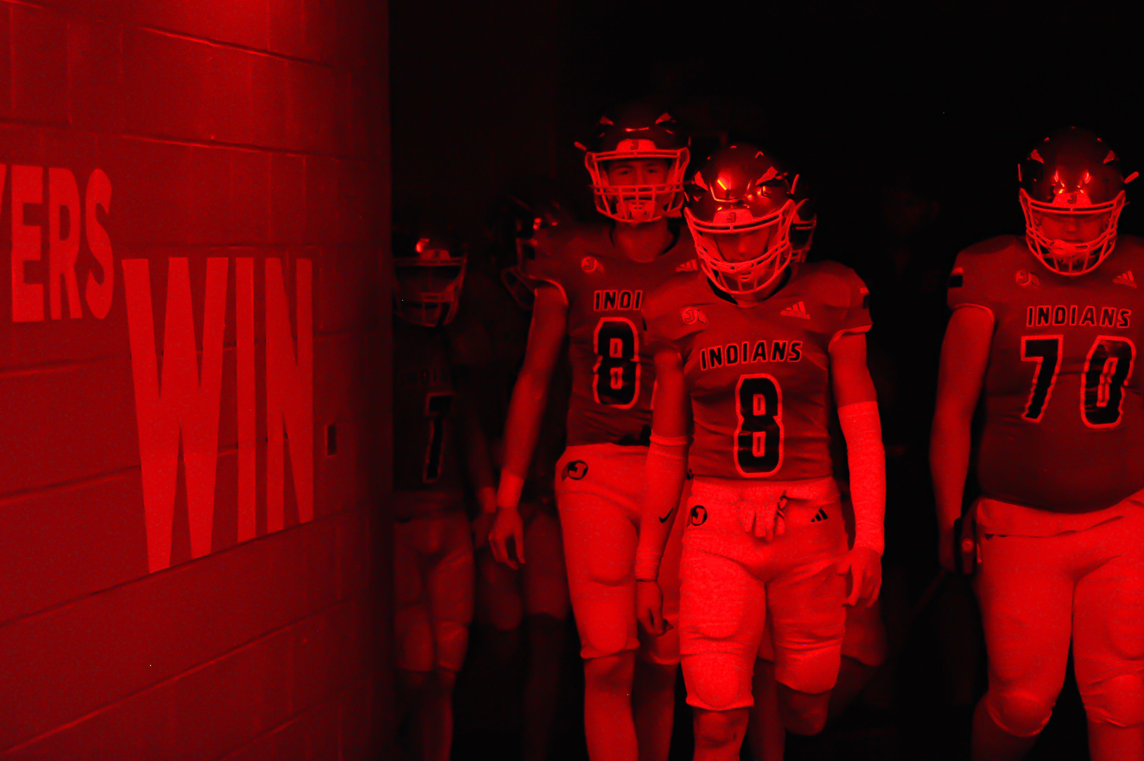 Jackson's Tyson Ford walks the team out before a Friday, October 25, 2024 game between the Jackson Indians and the Festus Tigers at "The Pit" in Jackson, Mo. Jackson defeated Festus, 43-7.