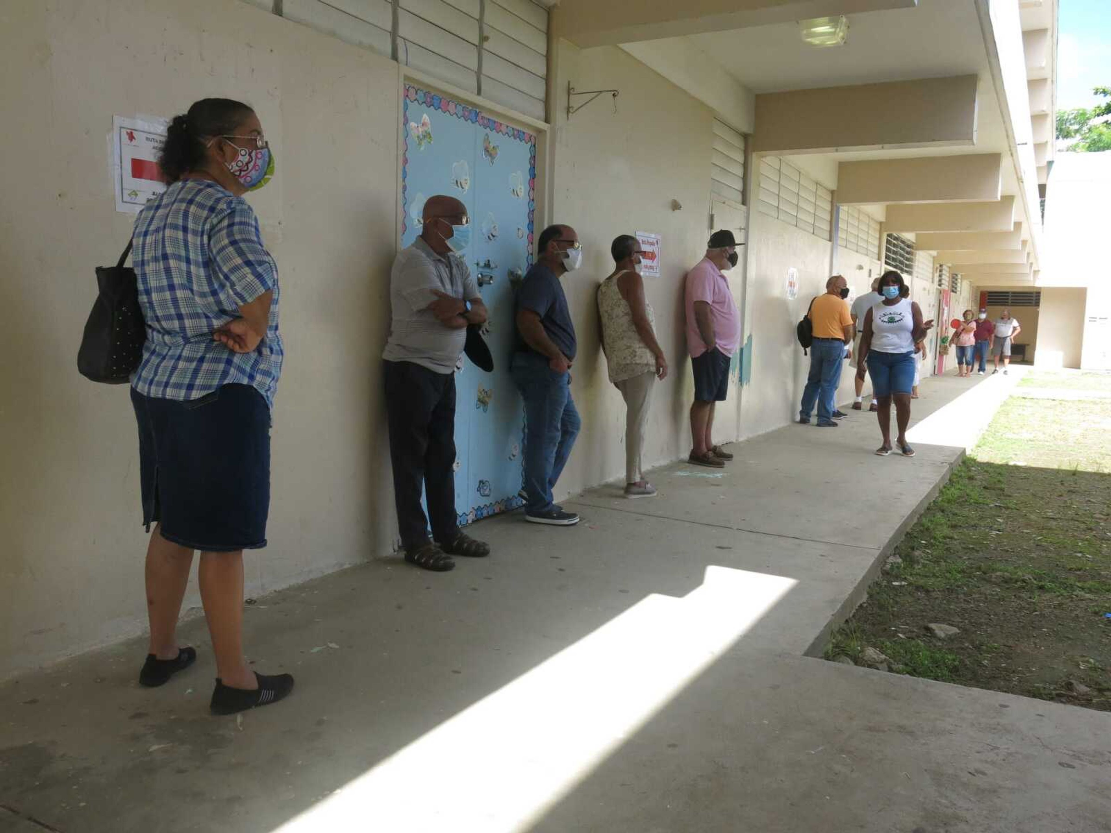 Voters wait to cast their ballots Sunday in Loiza, Puerto Rico. Thousands of Puerto Ricans on Sunday got a second chance to vote for the first time, a week after delayed and missing ballots marred the original primaries in a blow to the U.S. territory' democracy.