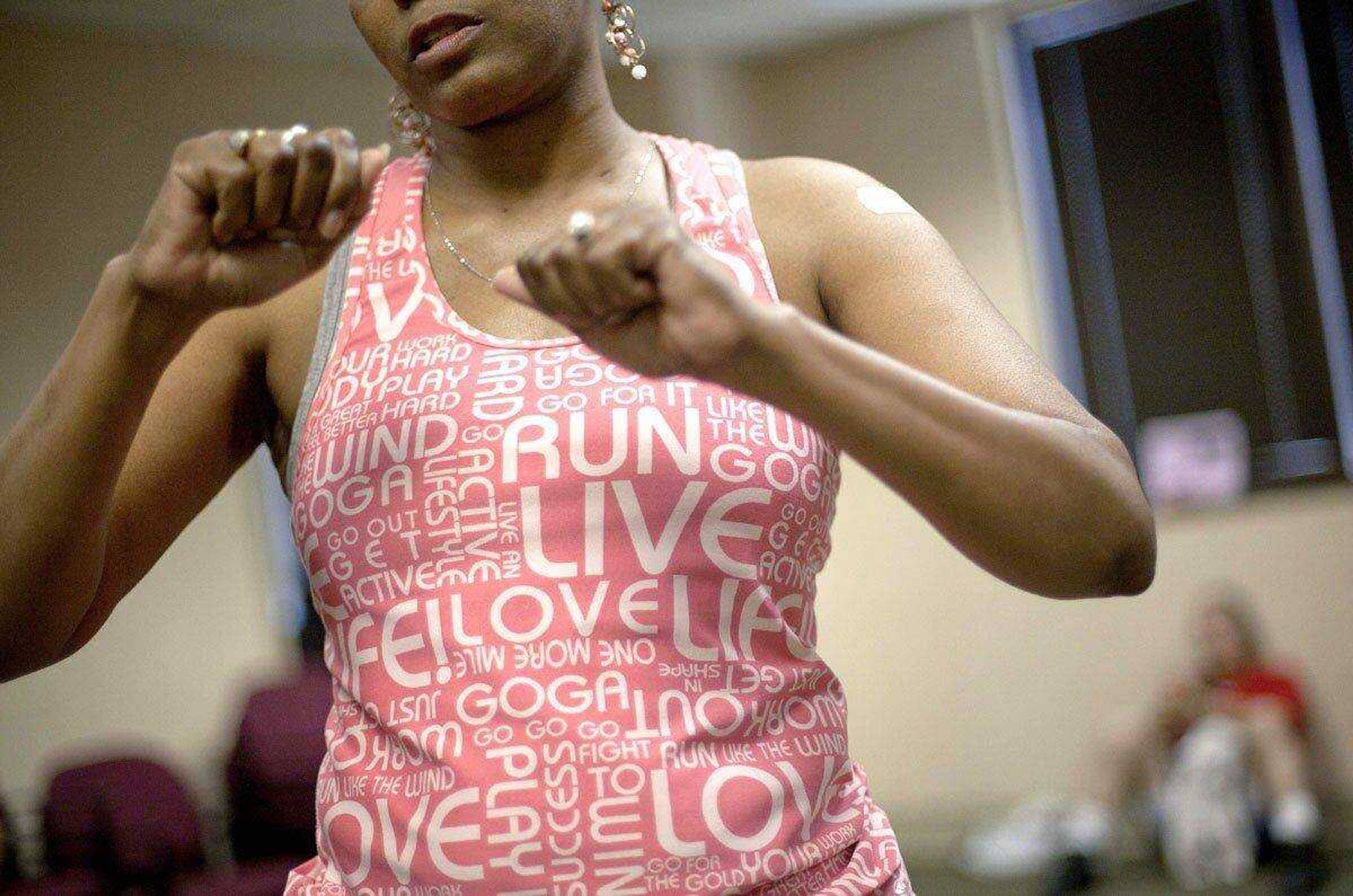 Cancer survivor Hastine Reese, 50, of Stockbridge Ga., talks April 25 after an exercise class, in Atlanta. (David Goldman ~ Associated Press)