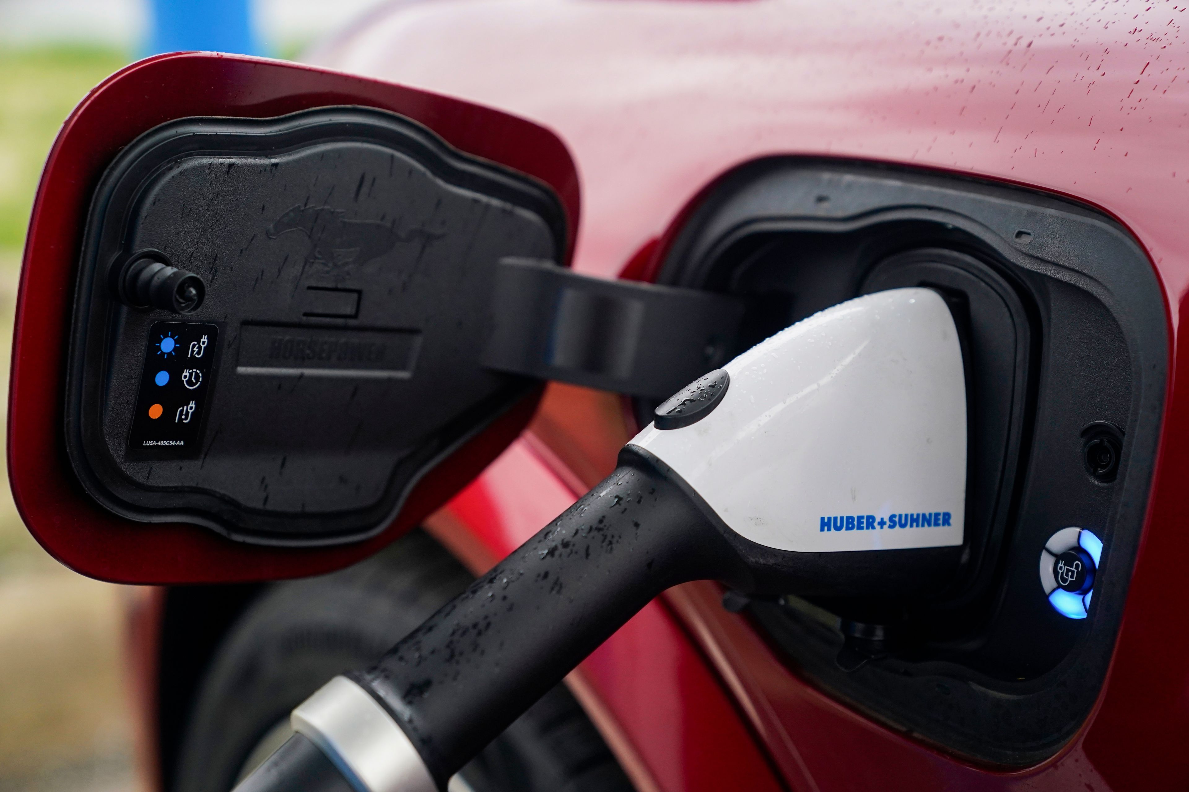 FILE - A 2023 Ford Mustang Mach-E charges, Friday, March 8, 2024, at an electric vehicle charging station in London, Ohio. (AP Photo/Joshua A. Bickel, File)