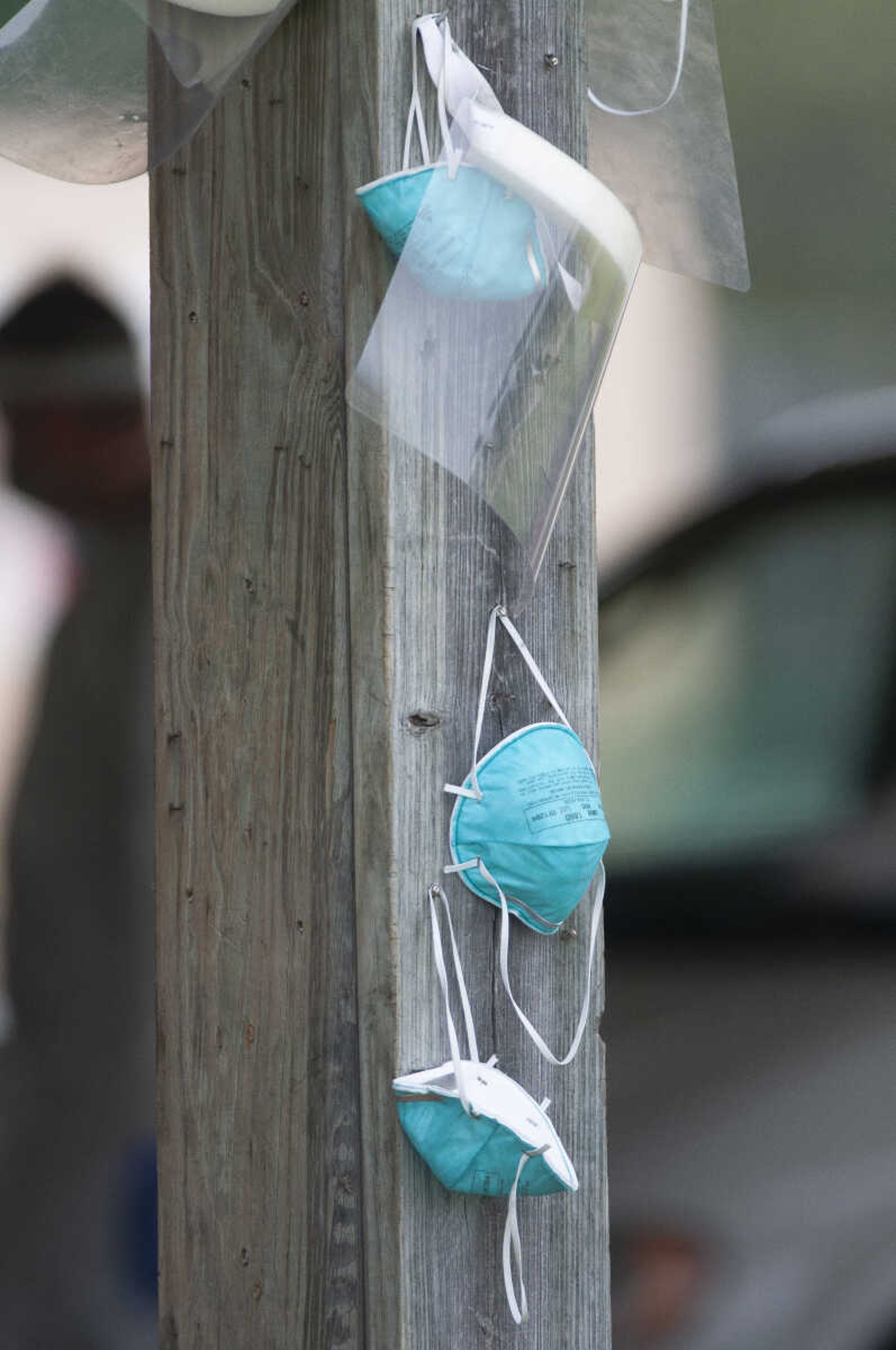 Face masks and shields hang during free COVID-19 testing Friday, June 5, 2020, at Arena Park in Cape Girardeau. The drive-through testing event was scheduled for 7 a.m. to 7 p.m.