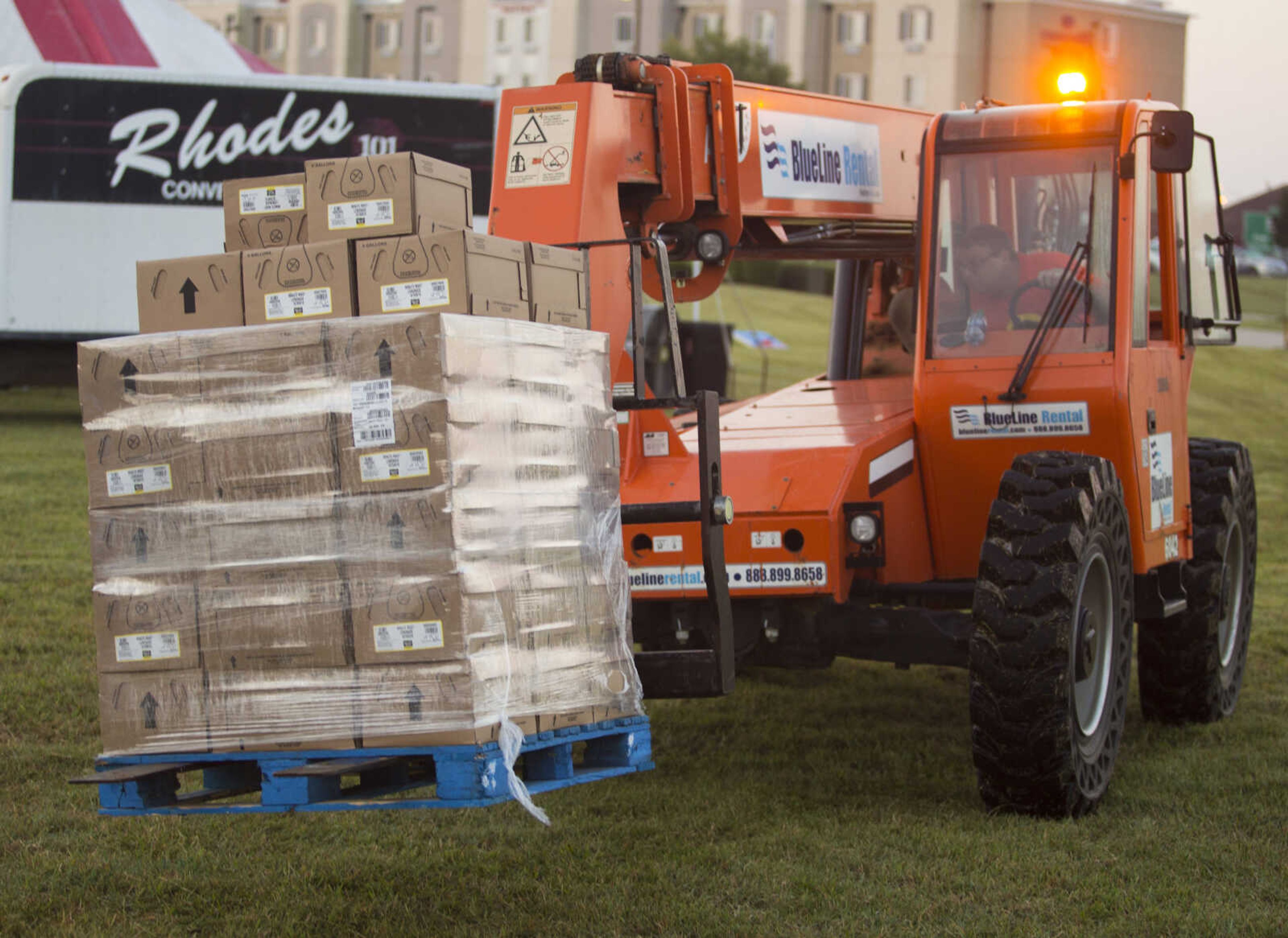 A Rhodes employee transports a pallet of lemonade syrup at Mercato Di Rodi in Cape Girardeau early Sunday morning during an attempt to break the Guinness World Record for largest cup/glass of soft drink.