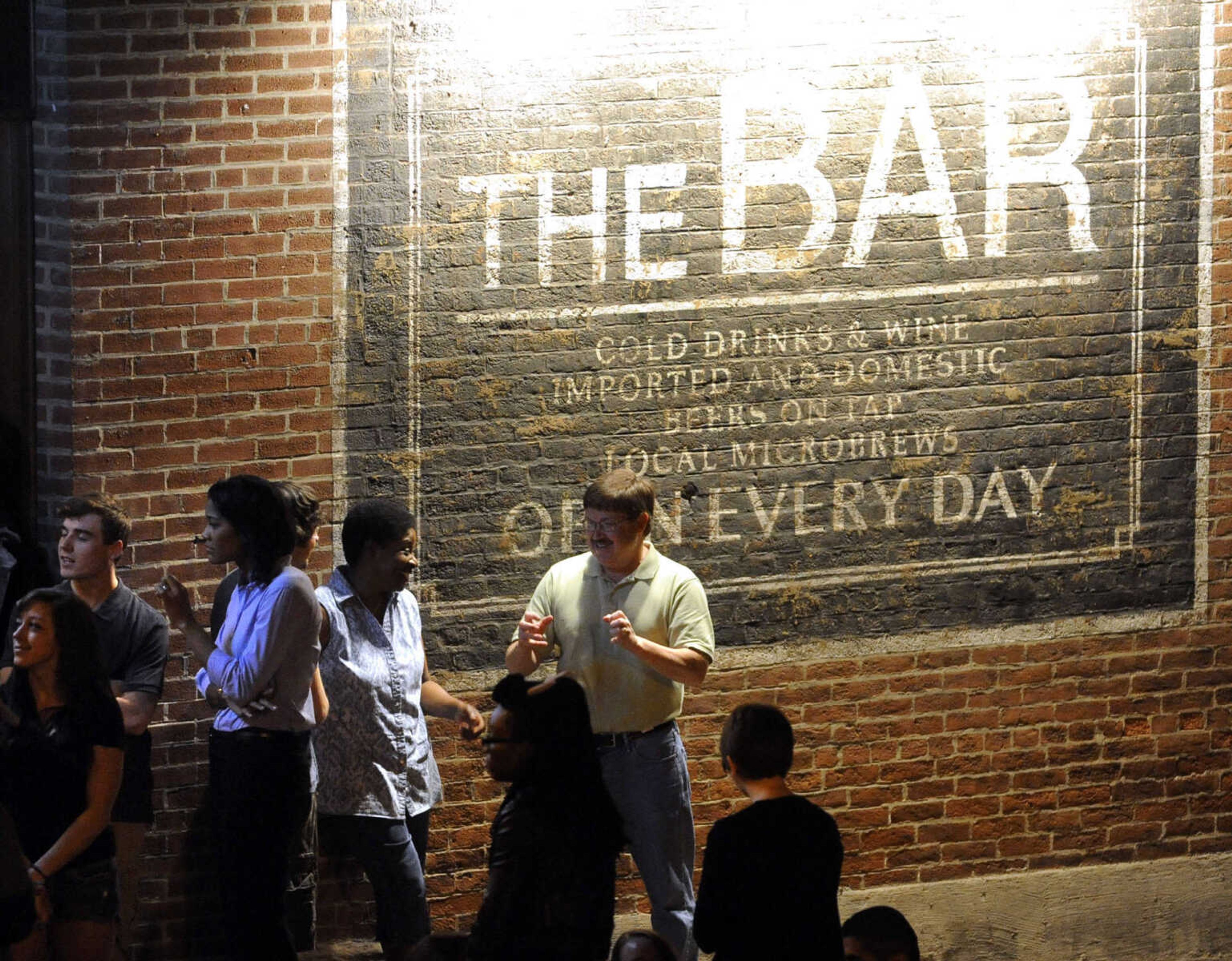 FRED LYNCH ~ flynch@semissourian.com
Extras for "Gone Girl" wait to rehearse outside The Bar Friday, Sept. 27, 2013 in downtown Cape Girardeau.