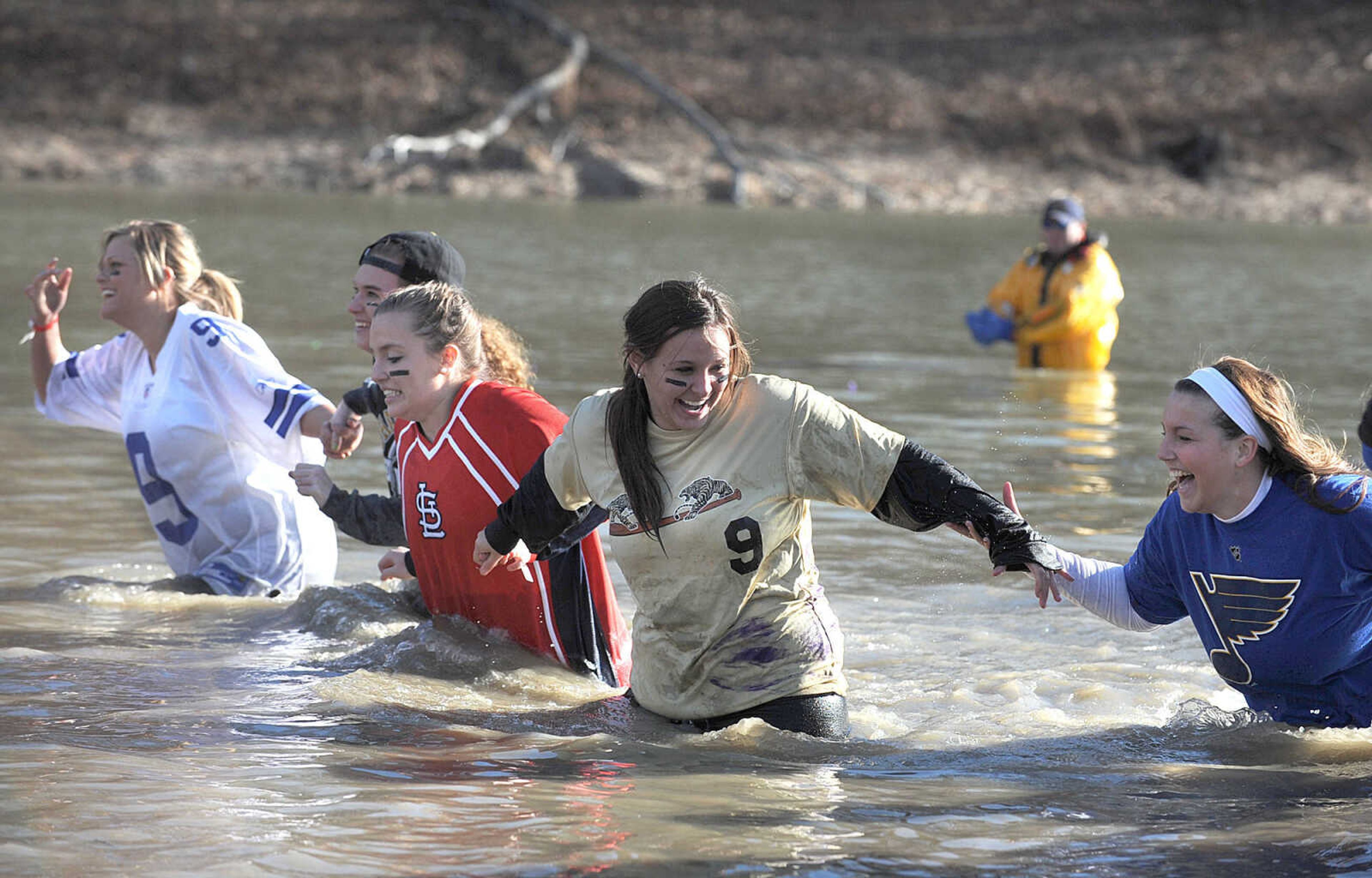 LAURA SIMON ~ lsimon@semissourian.com
People plunge into the cold waters of Lake Boutin Saturday afternoon, Feb. 2, 2013 during the Polar Plunge at Trail of Tears State Park. Thirty-six teams totaling 291 people took the annual plunge that benefits Special Olympics Missouri.