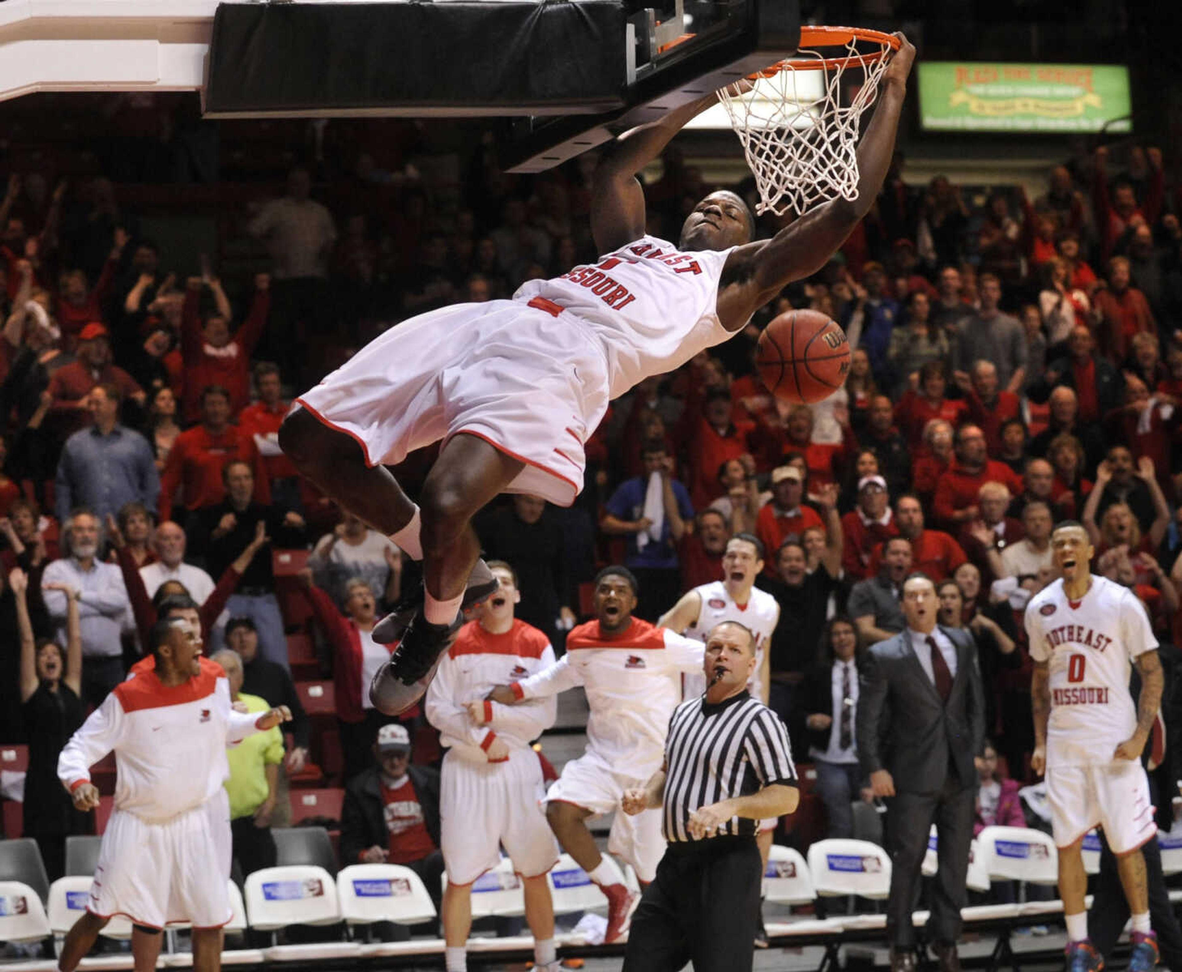 FRED LYNCH ~ flynch@semissourian.com
Southeast Missouri State's Nino Johnson dunks while hanging on the rim, for which he was called for a technical foul, in the closing seconds of double overtime against Murray State on Saturday, March 1, 2014 at the Show Me Center.