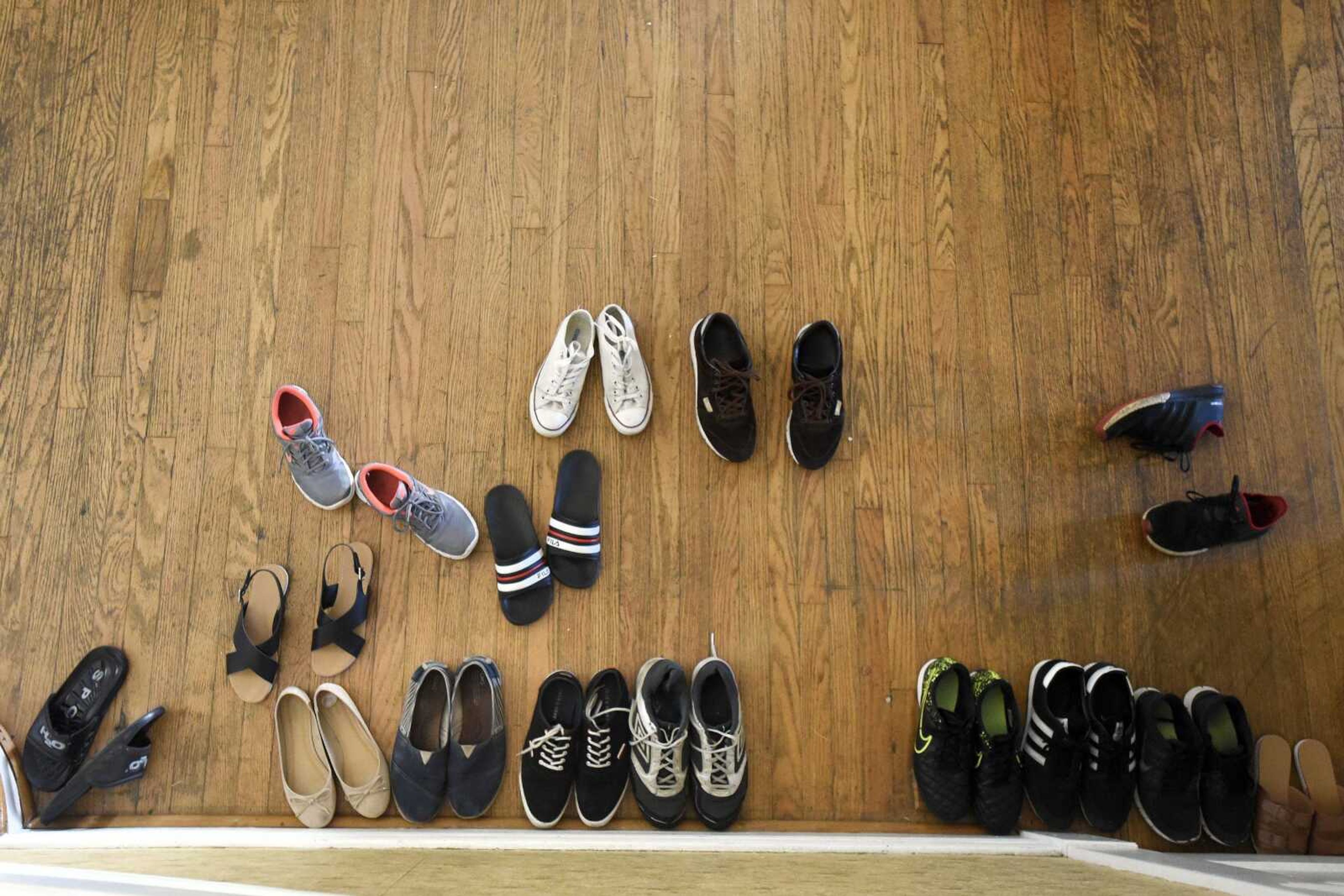 Shoes are set inside the front door at the home of exchange students.