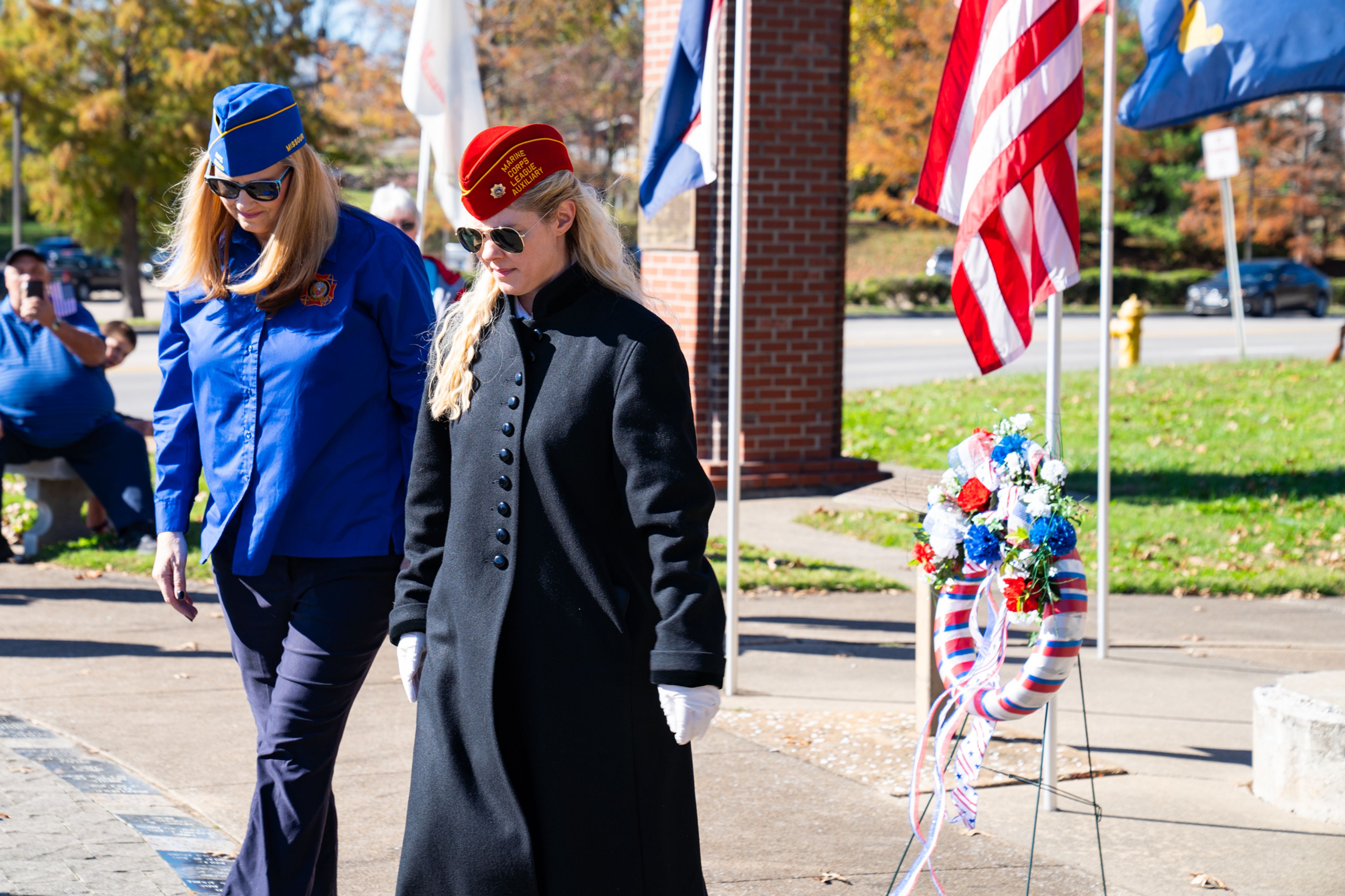 (Left) VFW Post Auxilary 3838 Carolyn Davis and the Marine Corps League Auxilary Unit 426 Janet Anders walk away after presenting the wreath of remembrance behind them on Monday, Nov. 11.