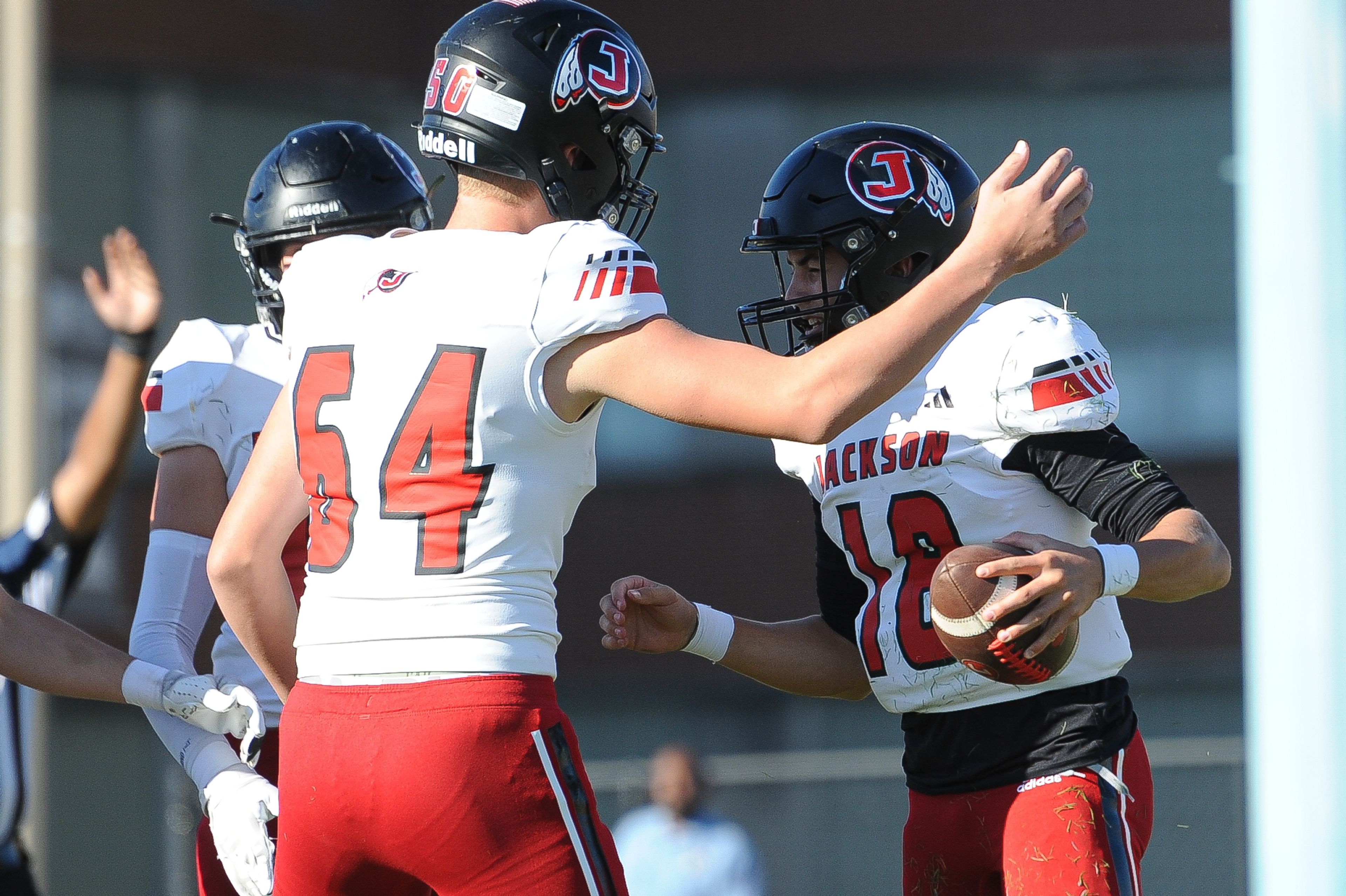 Jackson's Tyler Fischer (right) celebrates a touchdown during a Saturday, October 19, 2024 game between the Miller Career/Vashon Phoenix and the Jackson Indians at Gateway STEM High School in St. Louis. Jackson defeated Miller Career, 55-14.