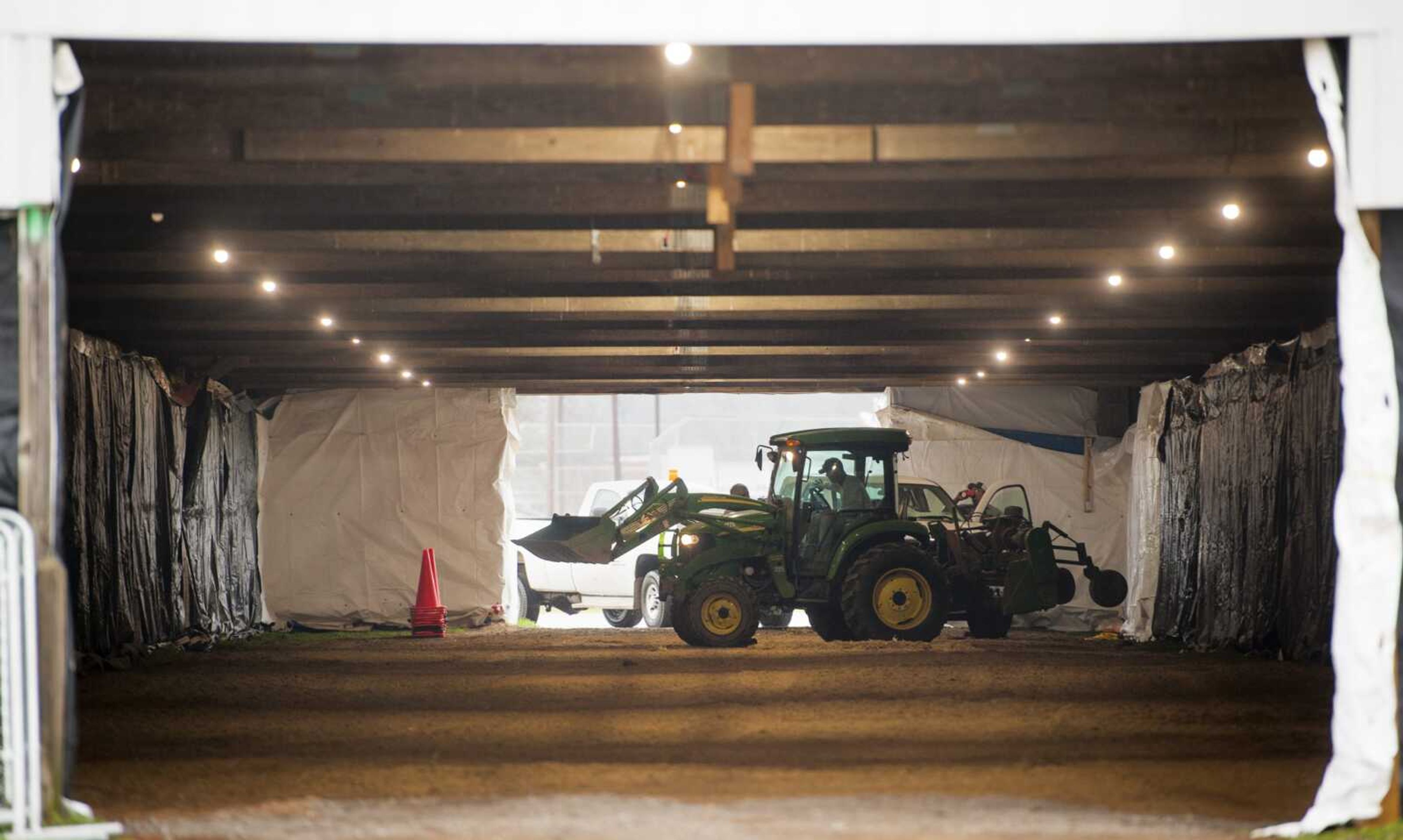 City of Cape Girardeau workers work inside the 4-H shelters in Arena Park as tarps surround the structure Thursday in Cape Girardeau. Thursday afternoon, Saint Francis Healthcare System officials said they are working to develop a Coronavirus Test Collection Center at the site with the City of Cape Girardeau, Cape Girardeau County Public Health Center and SoutheastHEALTH. Saint Francis also said it has activated a dedicated Nurse Coronavirus Hotline to answer any COVID-19 questions as well as provide screenings and next steps if needed. This hotline is available from 8 a.m. to 5 p.m. Mondays through Fridays at (573) 331-4200. The plan is to extend hours and days as needed. The hotline is for calls related to coronavirus screening only. The screening questions can also be completed online at sfmc.net/COVID19qanda. See the Southeast Missourian Weekend edition for more on Saint Francis and SoutheastHEALTH virus-related actions.