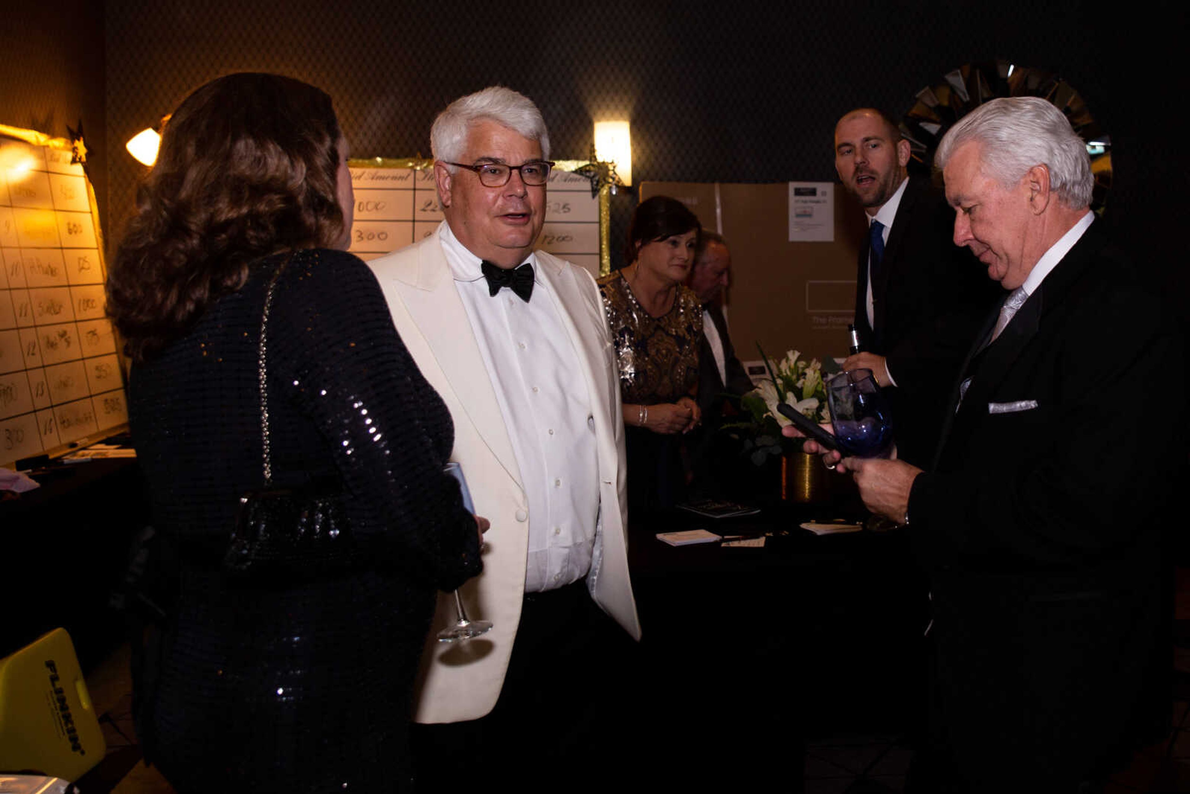 Dinner guests participate in the auction.