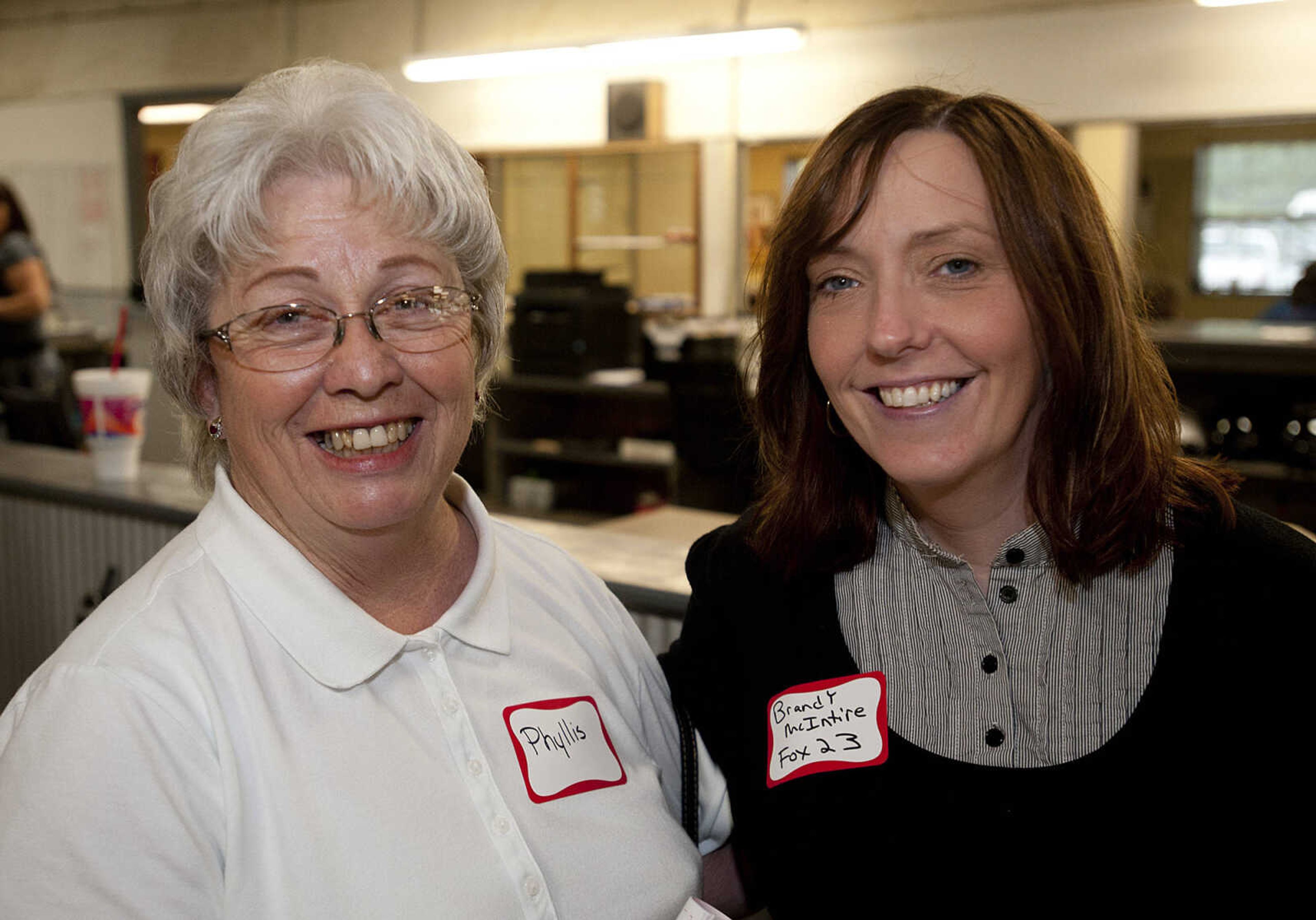 Phyllis Mohney, left, P&L Home and Property Inspections, and Brandy McIntire, Fox 23,  during the Jackson Area Chamber of Commerce's After Hours event Tuesday, May 13,  at First Auto Credit in Jackson, Mo.