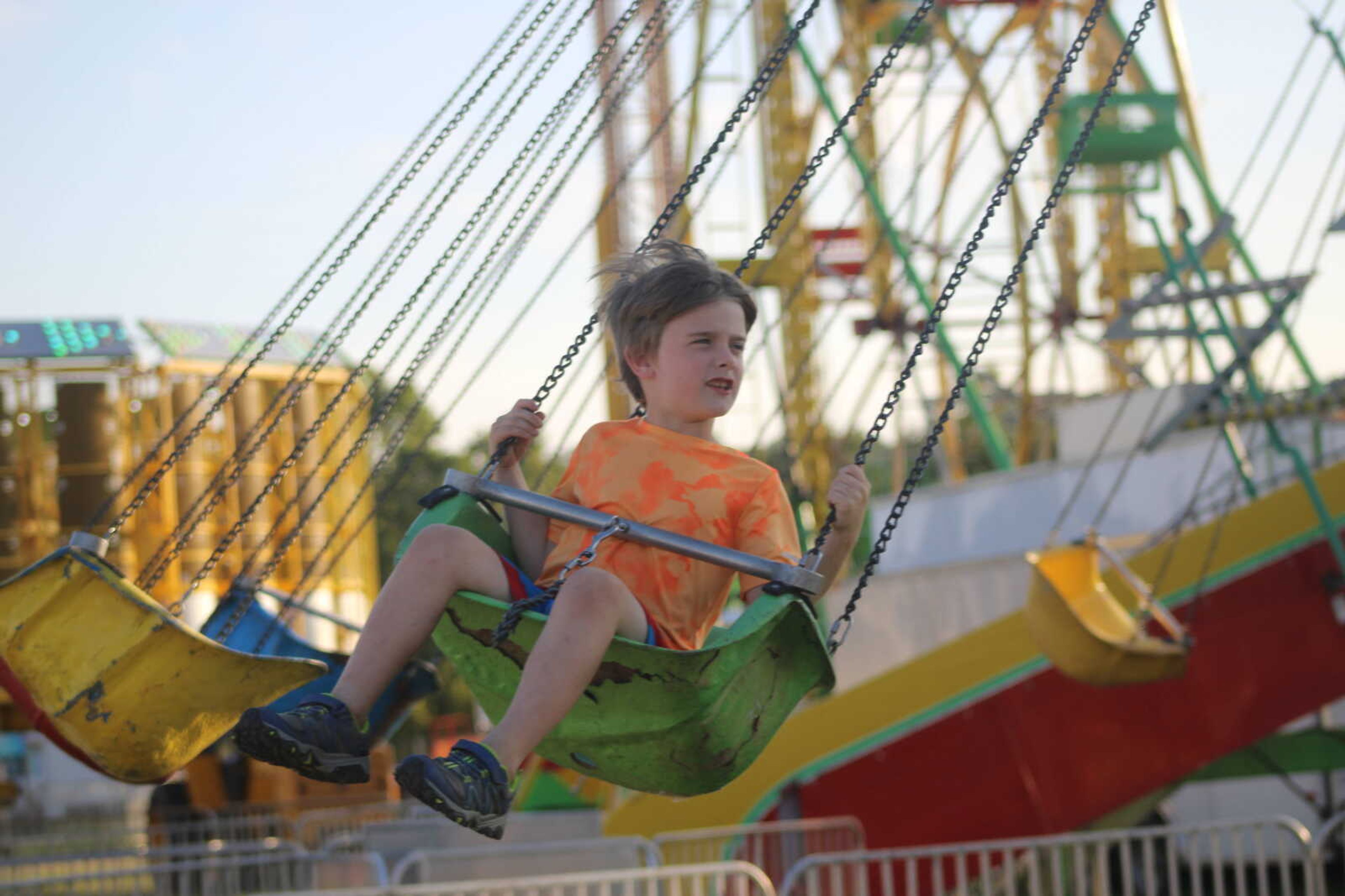 Leo Madden enjoys the swings at the SEMO District fair.