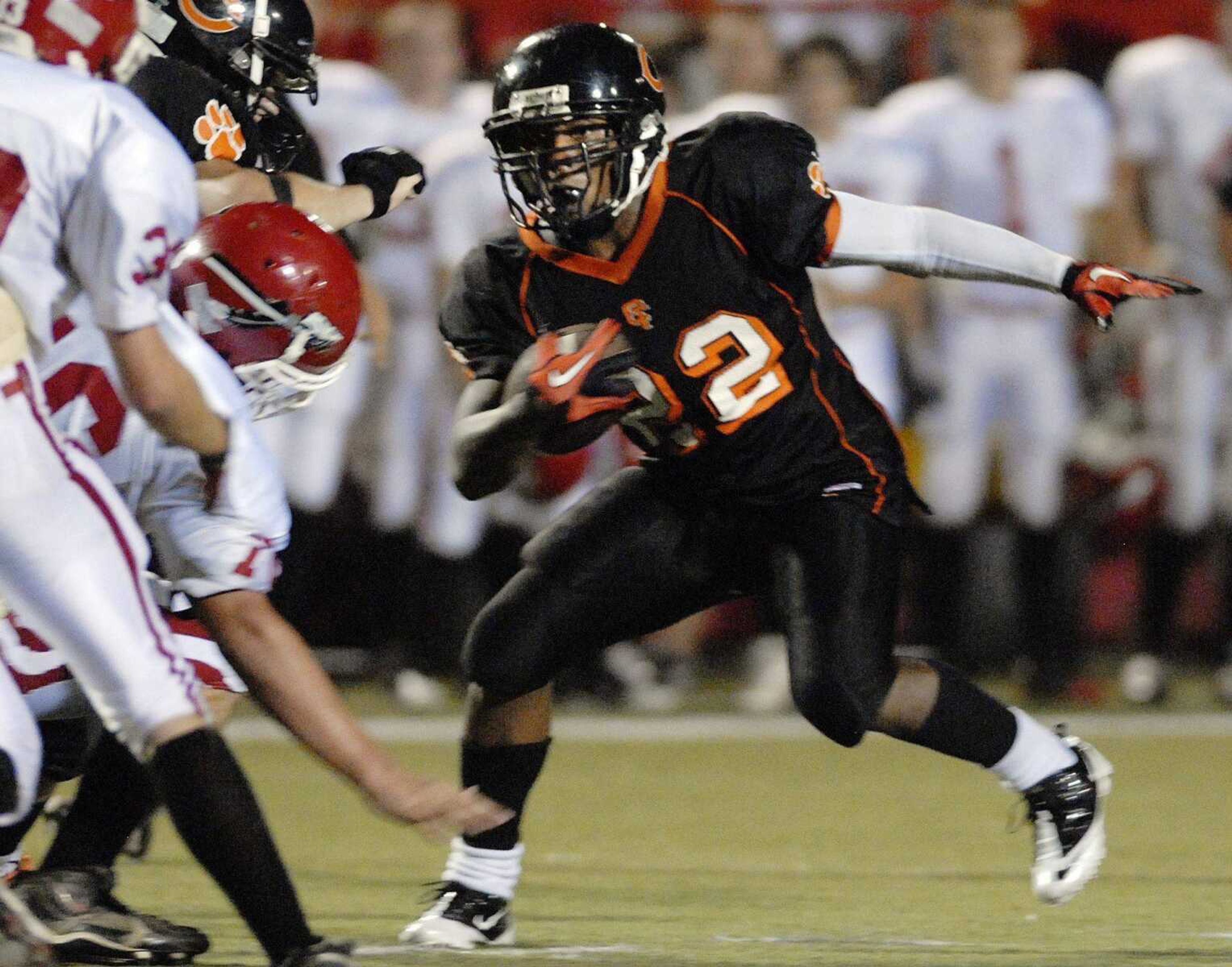 Central running back Keilon Moore tries to juke the Jackson defense during Friday's game. He rushed for 95 yards and two touchdowns.