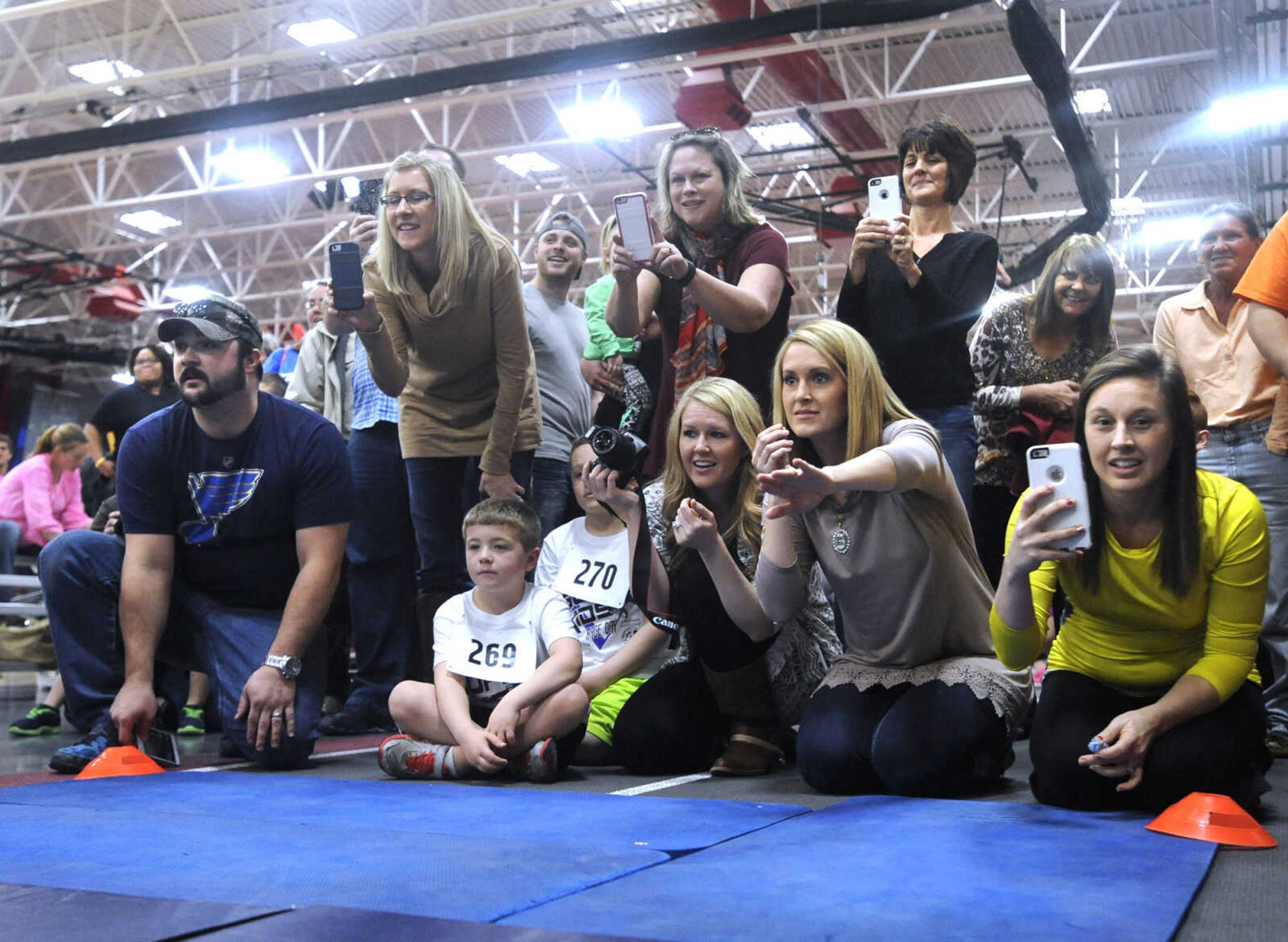 FRED LYNCH ~ flynch@semissourian.com
Family members offers lots of encouragement at the finish line of the baby crawl during the Super Kids Race Day on Sunday, Feb. 7, 2016 at the Student Recreation Center.