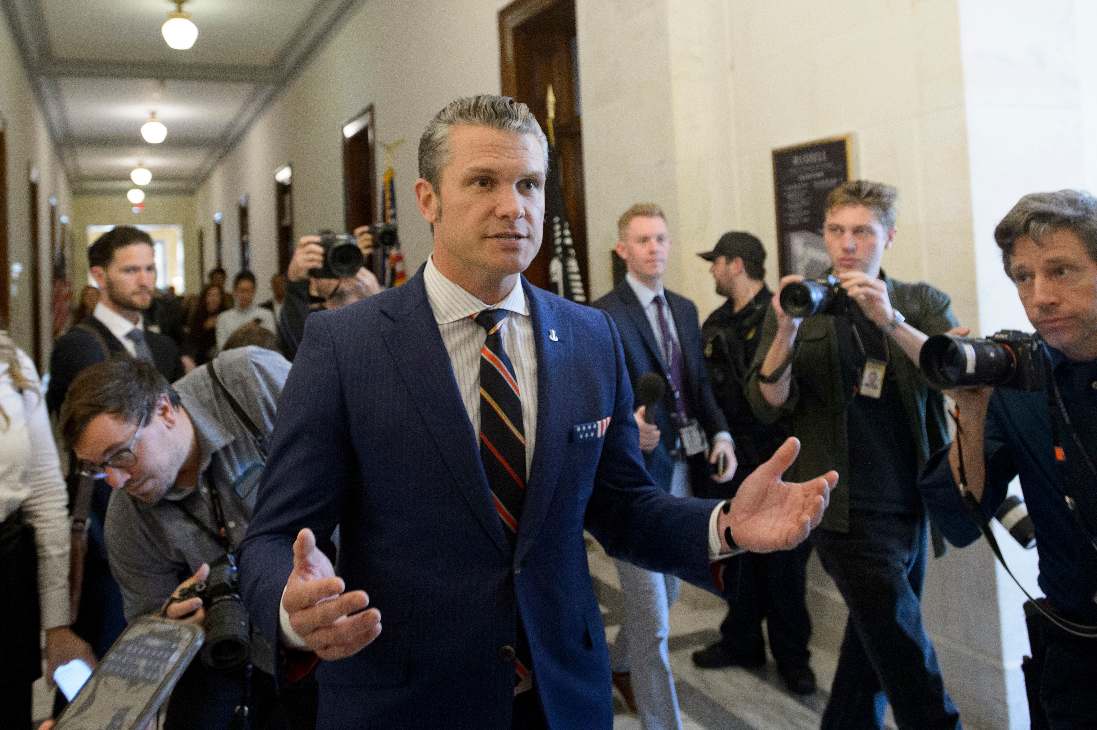 FILE - Pete Hegseth, President-elect Donald Trump's pick for secretary of defense, speaks with reporters following a meeting with senators on Capitol Hill, on Nov. 21, 2024, in Washington. (AP Photo/Rod Lamkey, Jr., File)