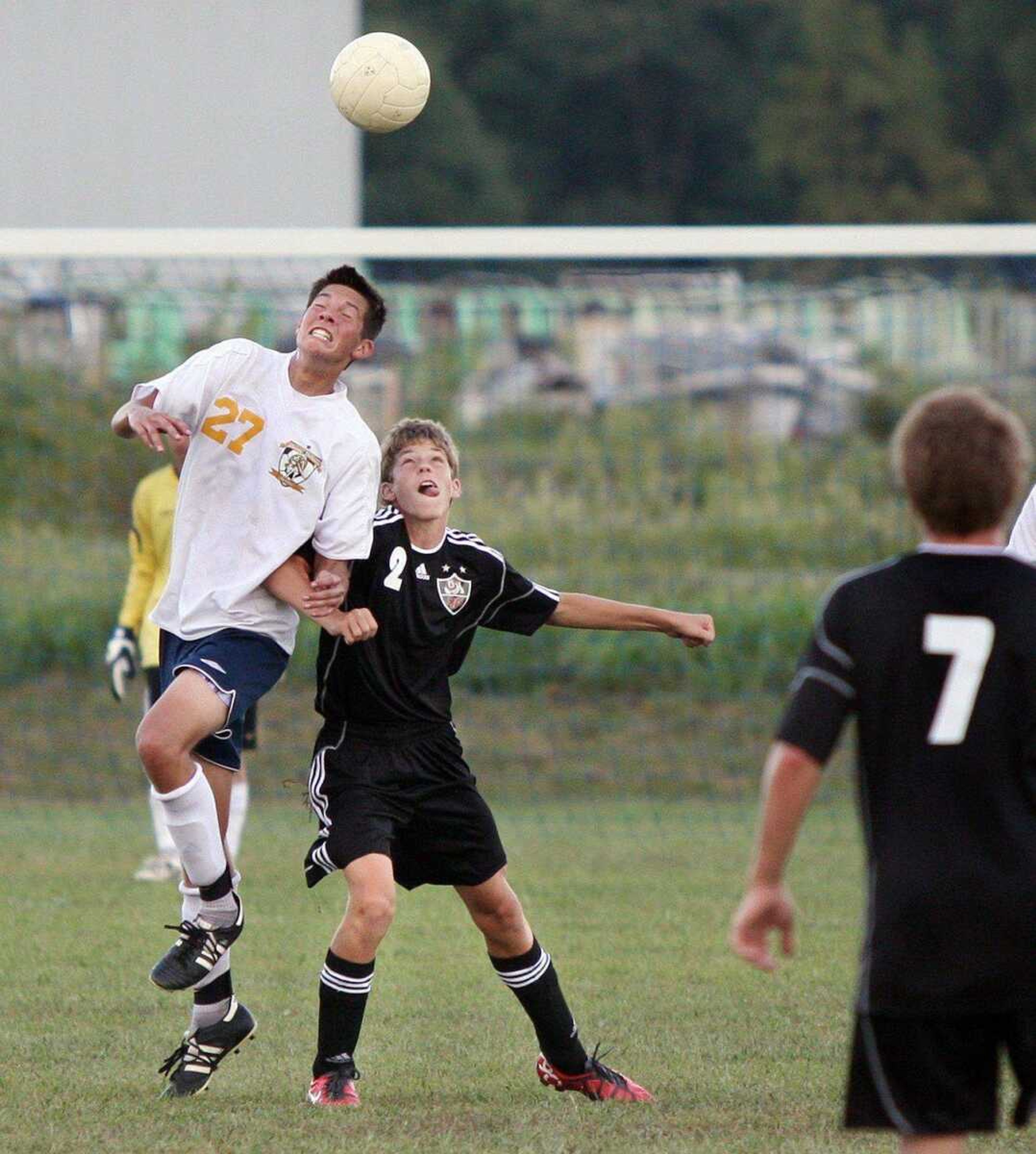 Saxony Lutheran's Ryan Sprandel leaps over a Sikeston defender as they battle for a ball Monday at Saxony Lutheran High School. Sikeston won 1-0. (TIM BRUMITT ~ Special to semoball.com)